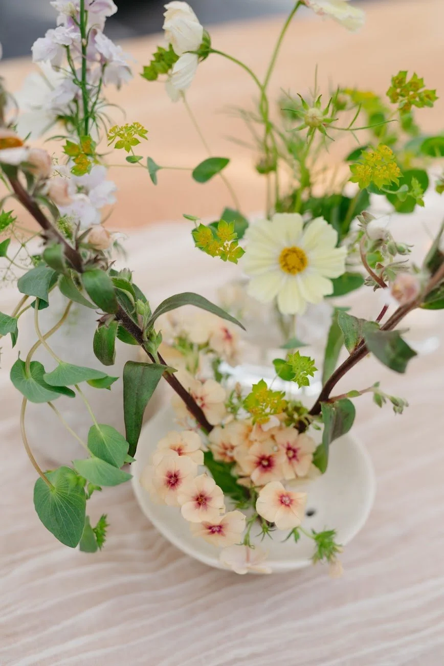  Playful arrangement with airy blooms, and trailing greenery   