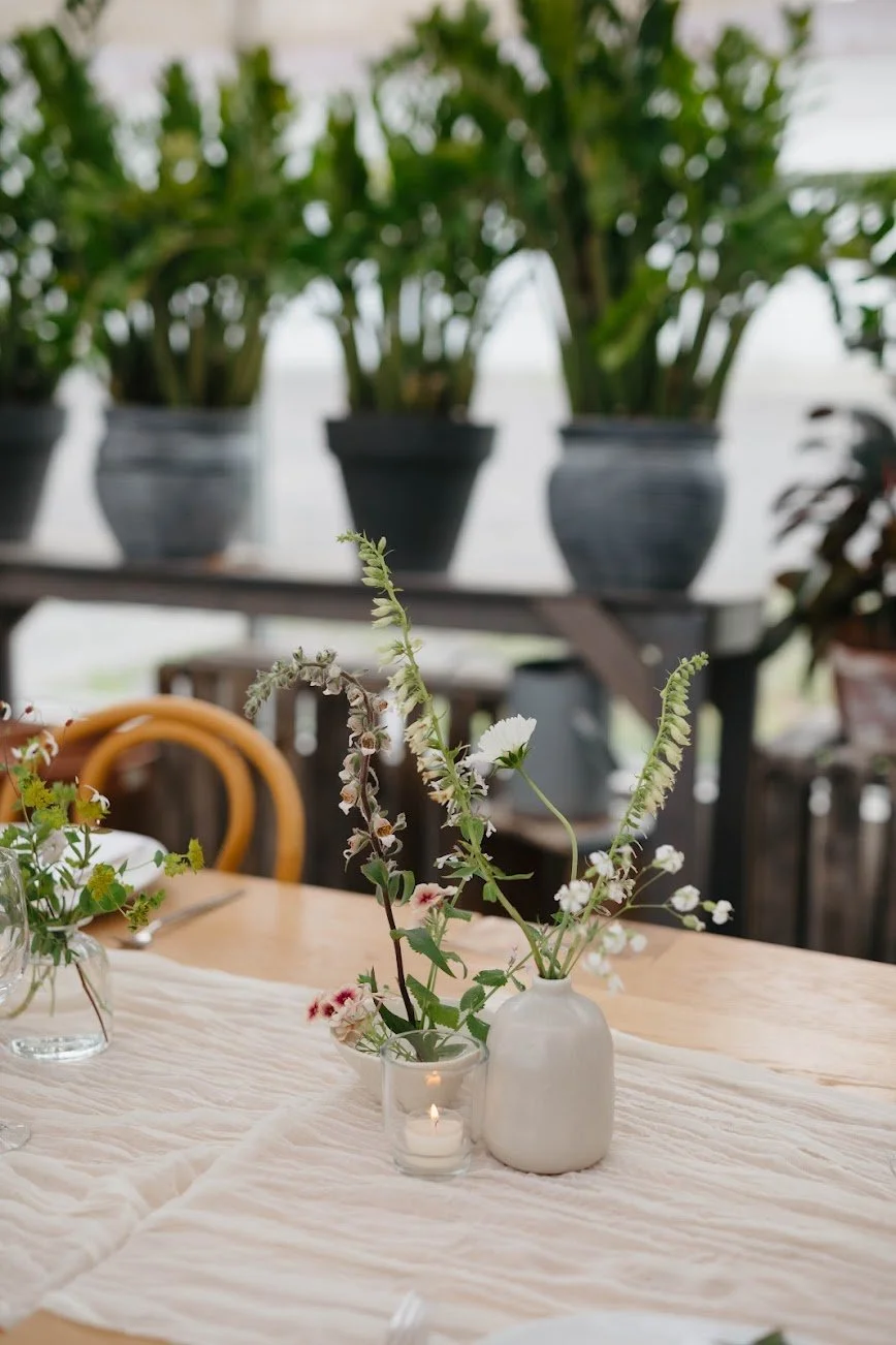 Bud vases with vibrant, tiny blossoms in ceramic and glass    