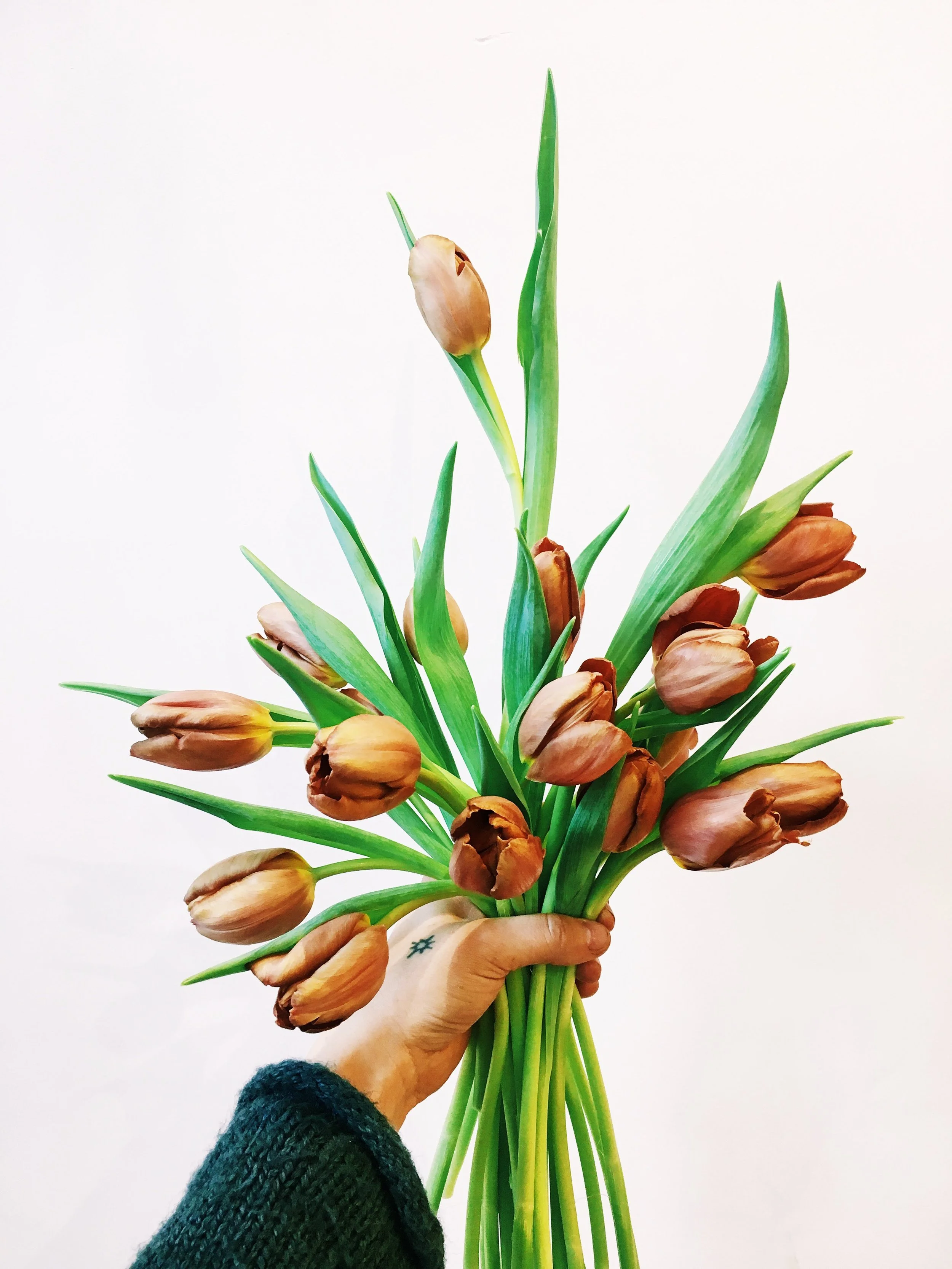  Closed organic spring flowers help in loose, just gathered style    