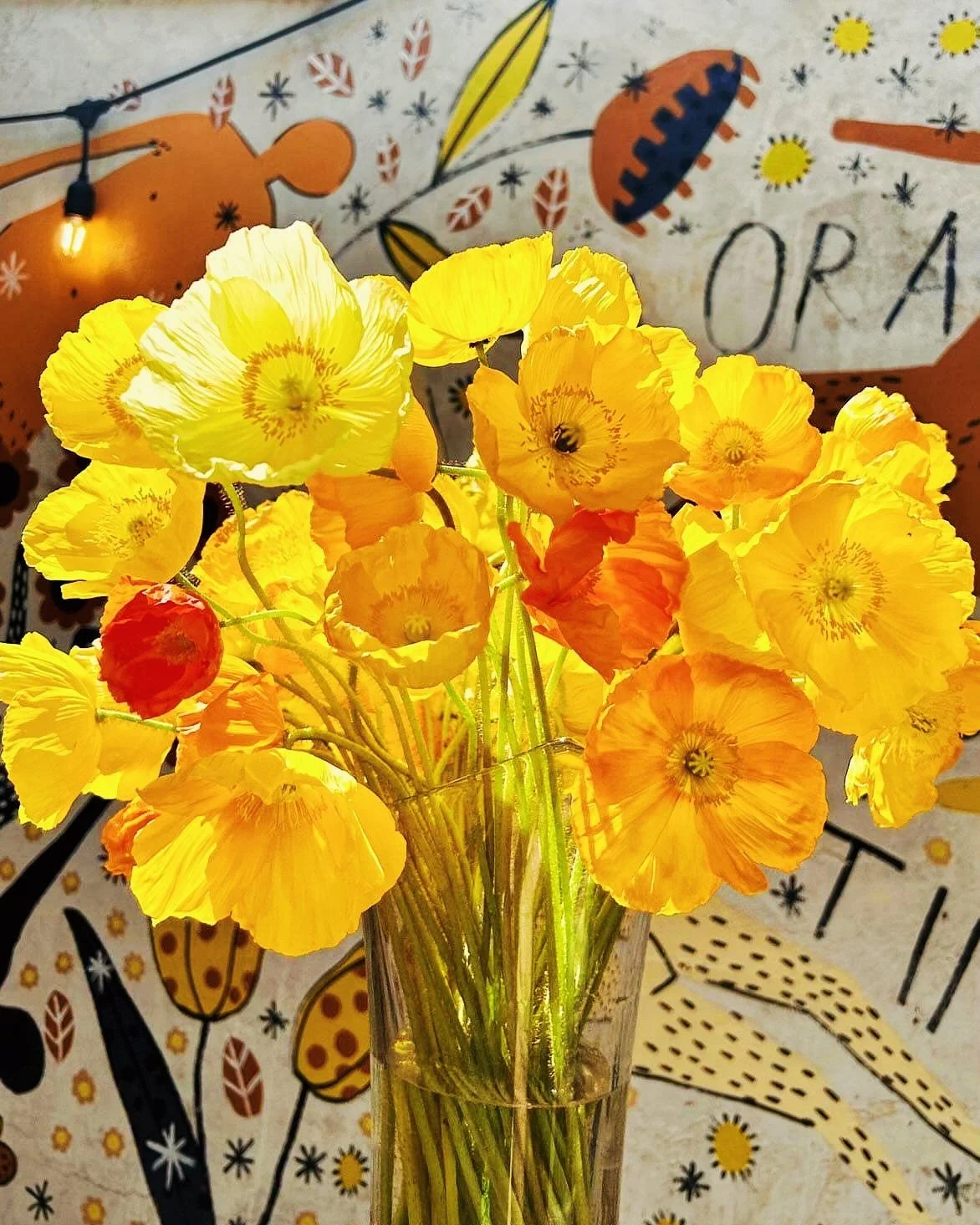  Bunch of airy yellow blooms in simple glass vase 