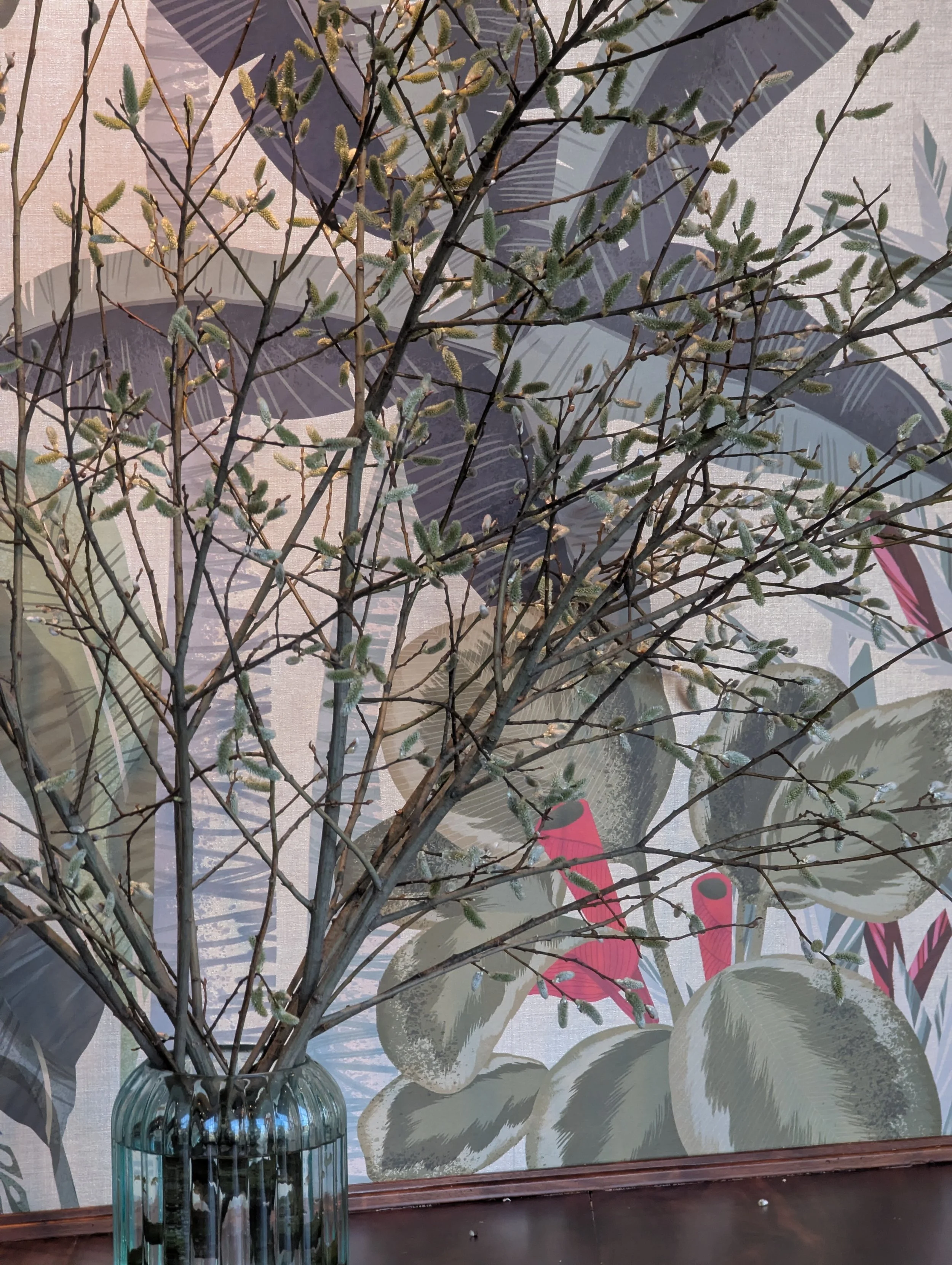  Sculptural pussy willow branches in large glass jar add contemporary vibe with their subtle flowers 
