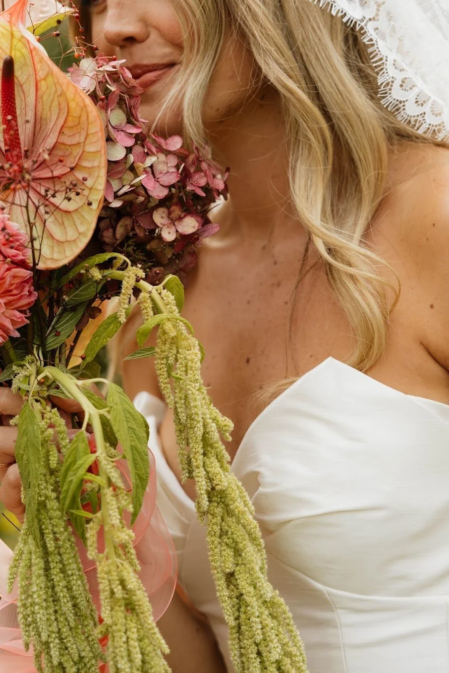  playful and drippy blossoms flow down brides personal bouquet 