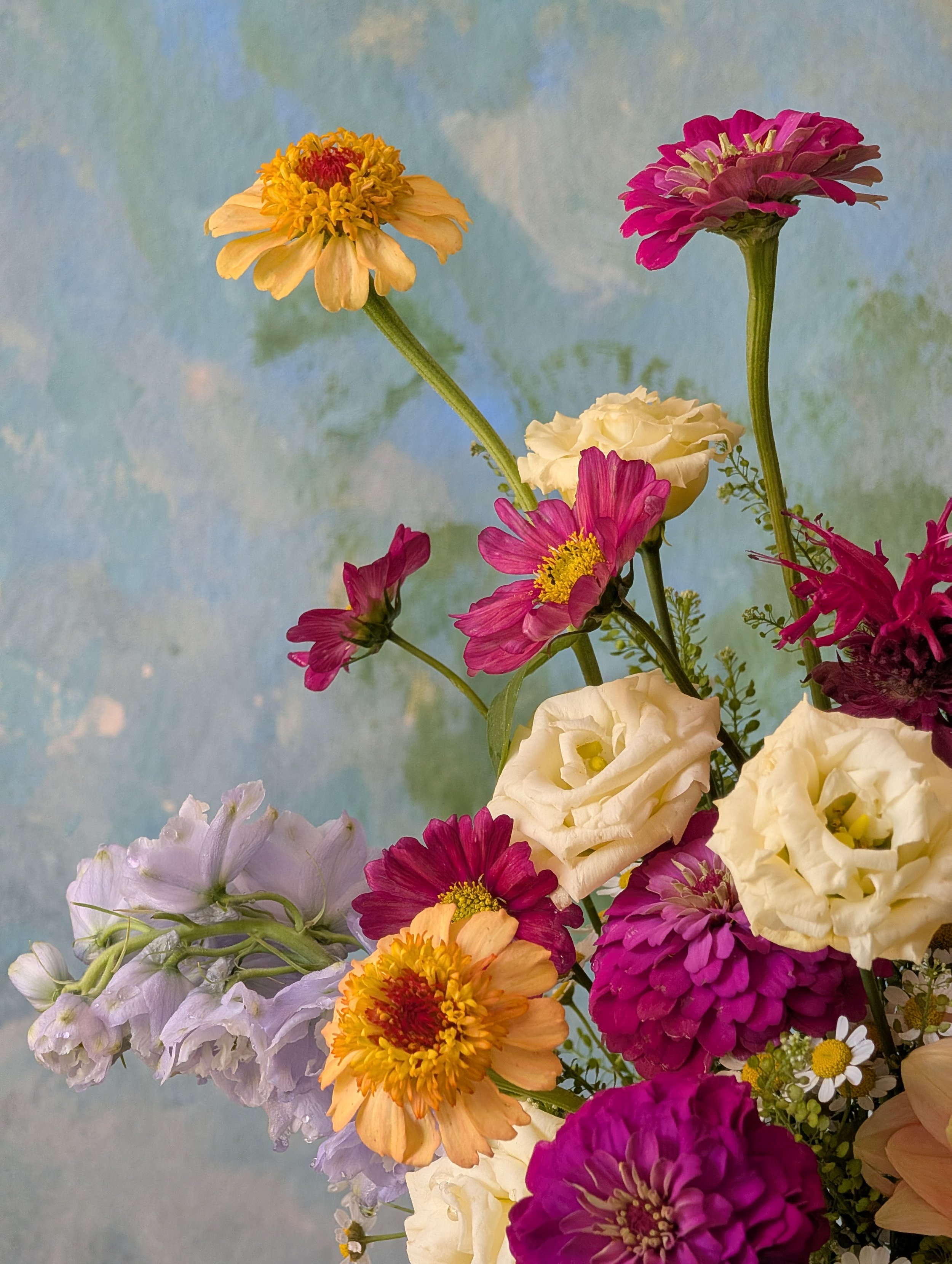  Arrangement featuring charming blossoms of different varieties and a spectrum of colors 
