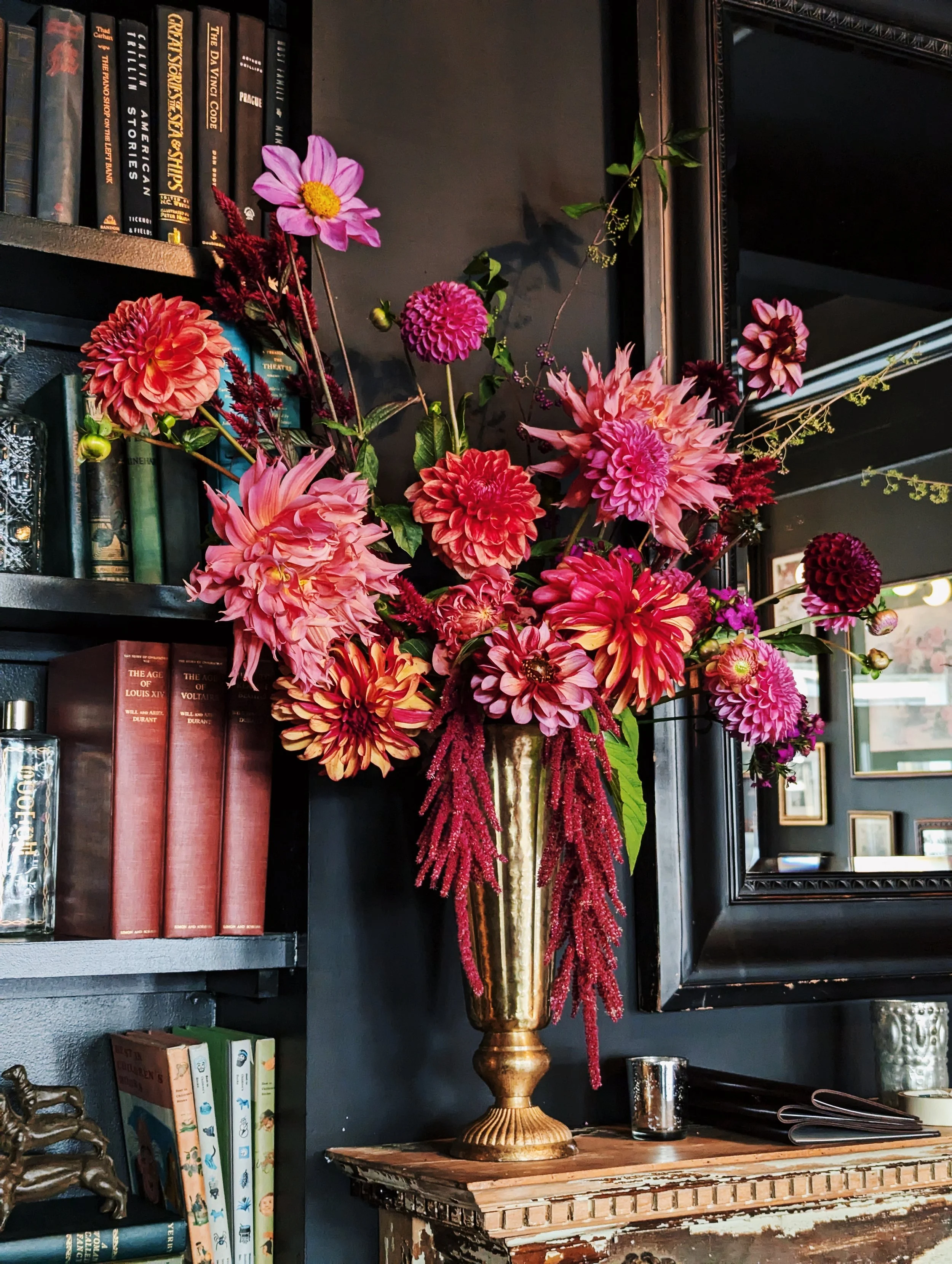  Bold and striking arrangement in elegant golden vase featuring various kinds of whimsical dahlia and various other flowers 