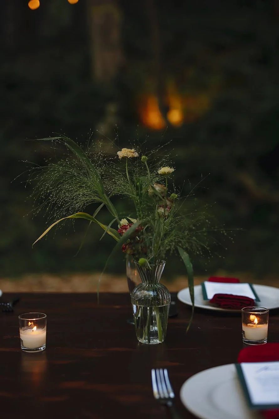  small glass bud vase featuring airy and delicate blooming grass   