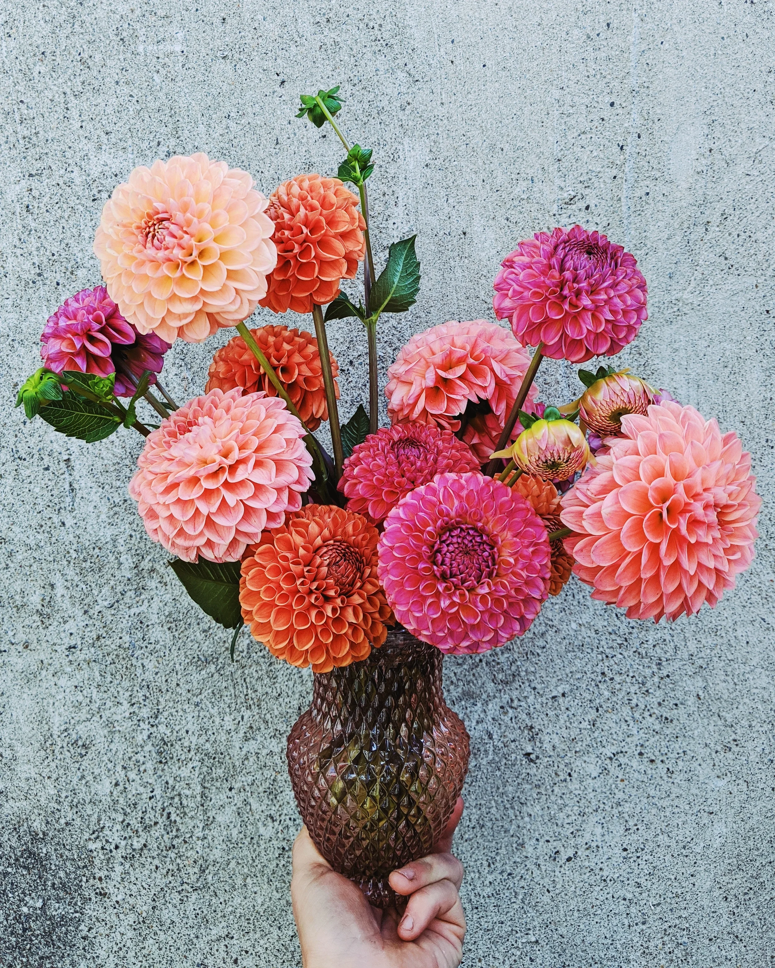  Charming little bouquet in contemporary, textured vase featuring playful signature blooms   