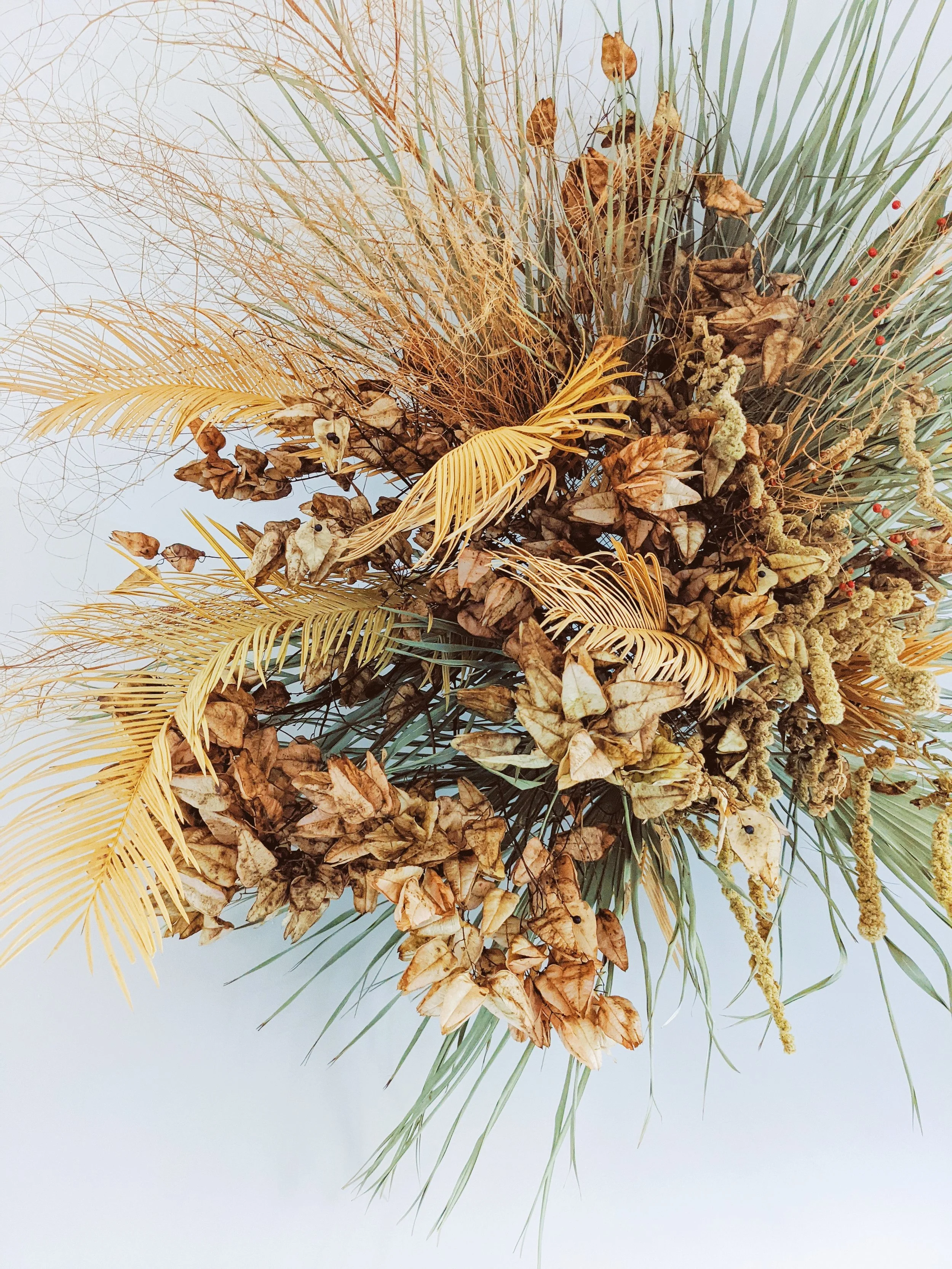  Sculptural composition with airy and spiky foliage using both fresh and dried flowers and leaves  