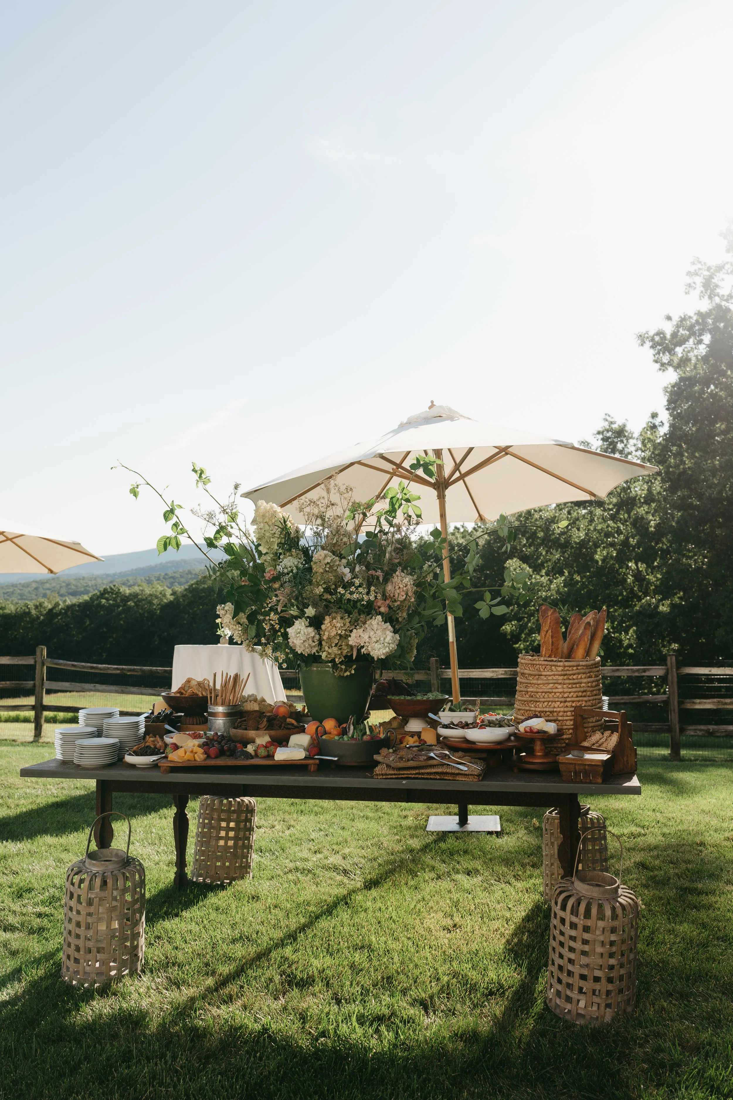 Seasonal floral arrangements decorating outdoor harvest table