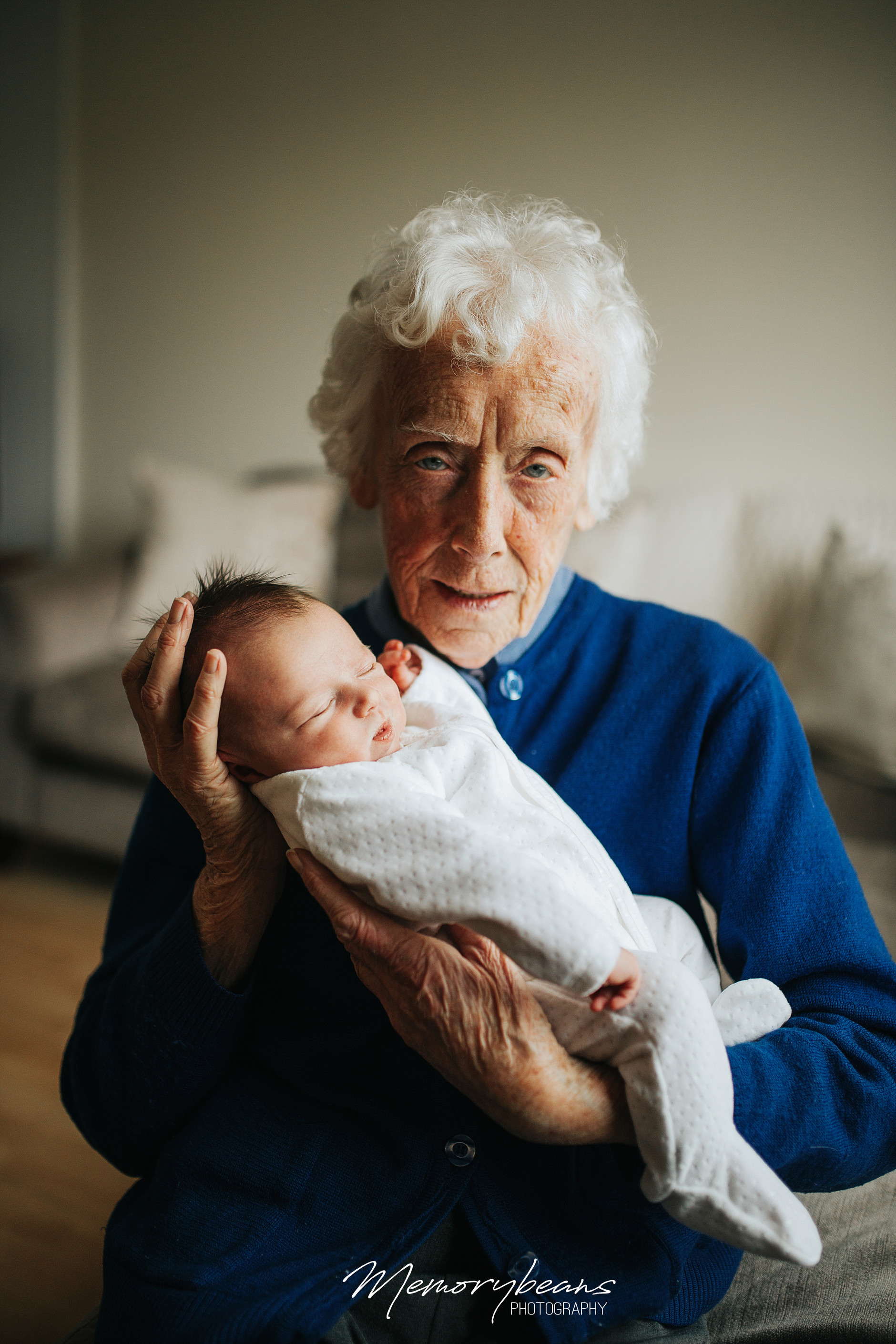 Great grandmother holding newborn baby