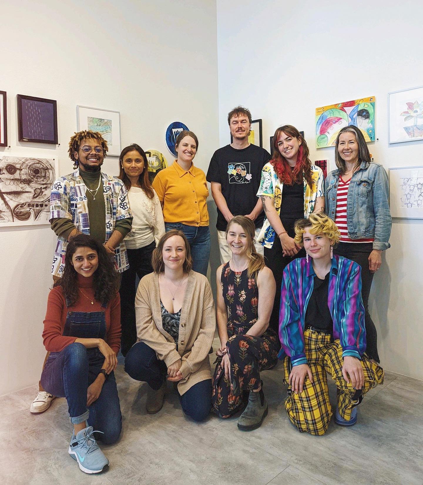 The ArtRecruits team celebrating their collective hard work, alongside the ongoing ArtRecruits exhibition running until May 24th at Studio C!