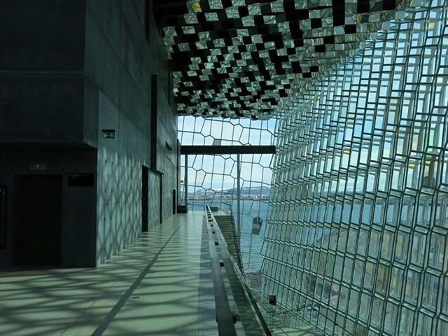 Harpa Concert Hall Reykjavik Iceland top foyer level looking towards the snow capped outlying mountain range 4 years since our visit to this amazing part of the world and how much it has all changed in 4 months stay safe stay home #Iceland #architect