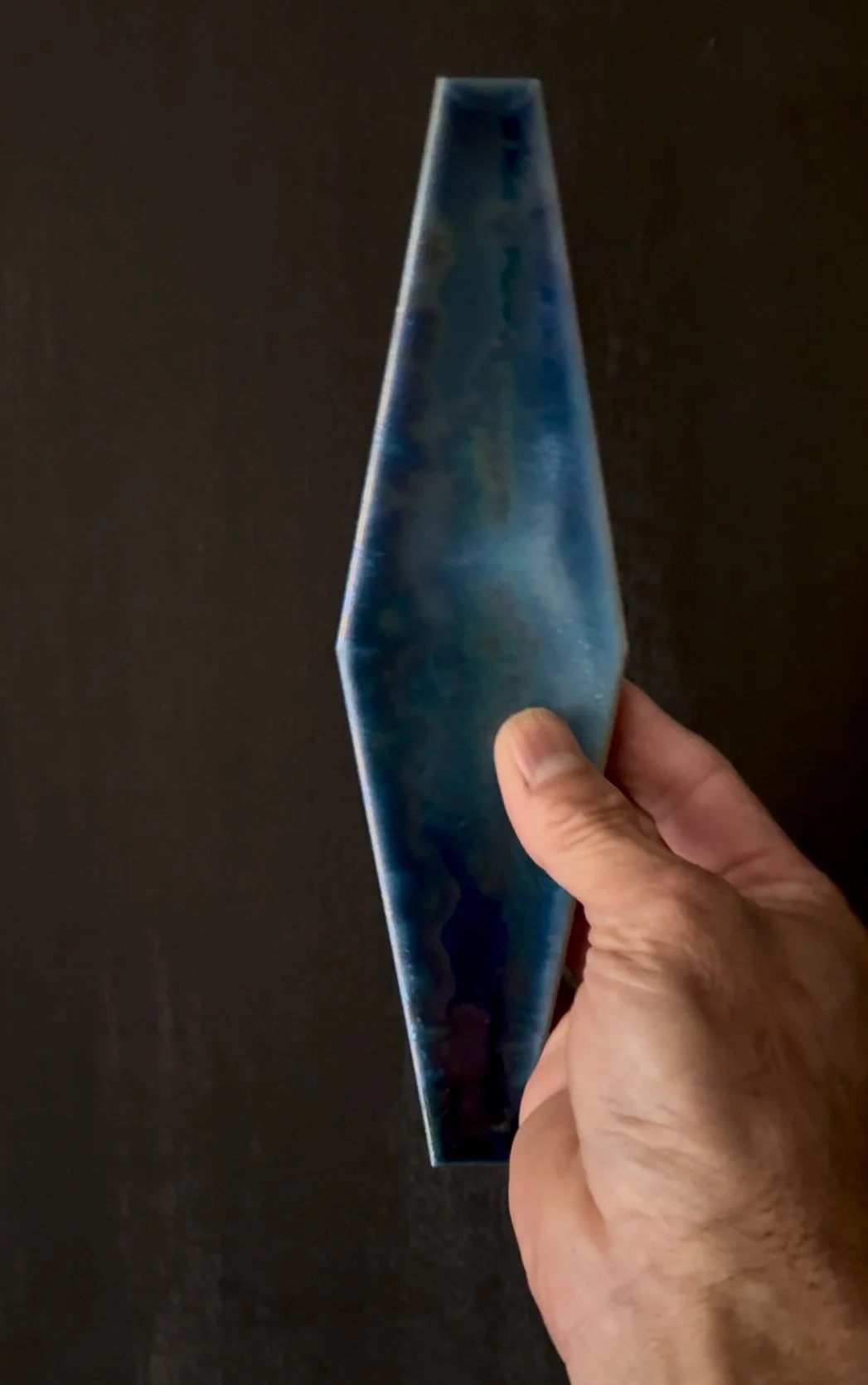 Handmade ceramic vessel by Rie Ochiai with iridescent glaze and softly textured surface.
