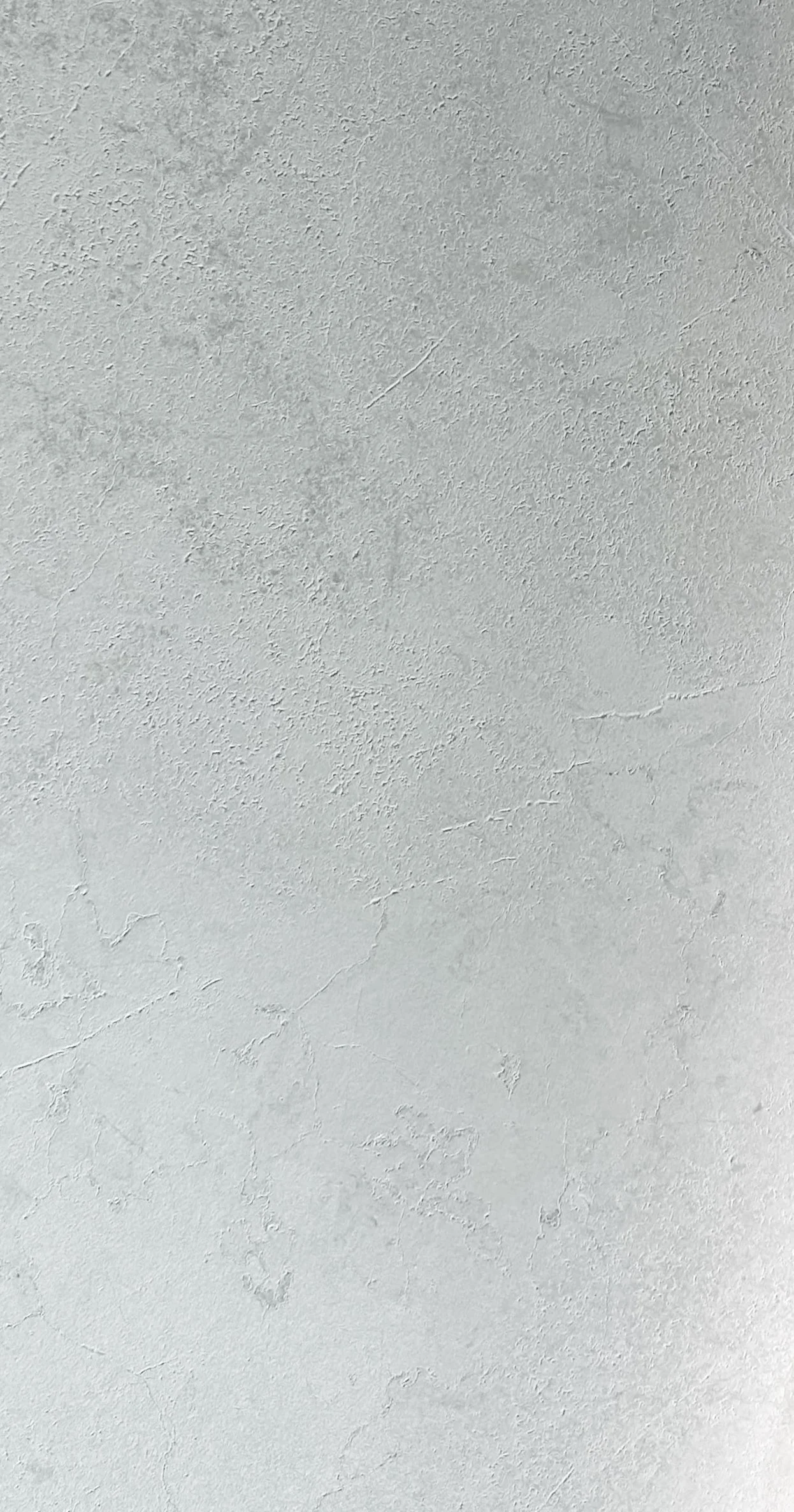 Wabi Sabi Shiro Rock by plonc. — authored porcelain surface featuring subtle weathered stone relief, soft mineral white tones and quiet tactile texture inspired by Japanese Wabi Sabi philosophy.
