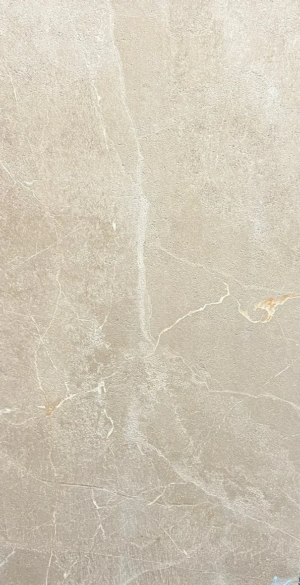 Dune Earth by plonc. — authored porcelain surface featuring weathered boulder stone relief, warm earth beige tones and natural oxidised mineral markings inspired by geological erosion.