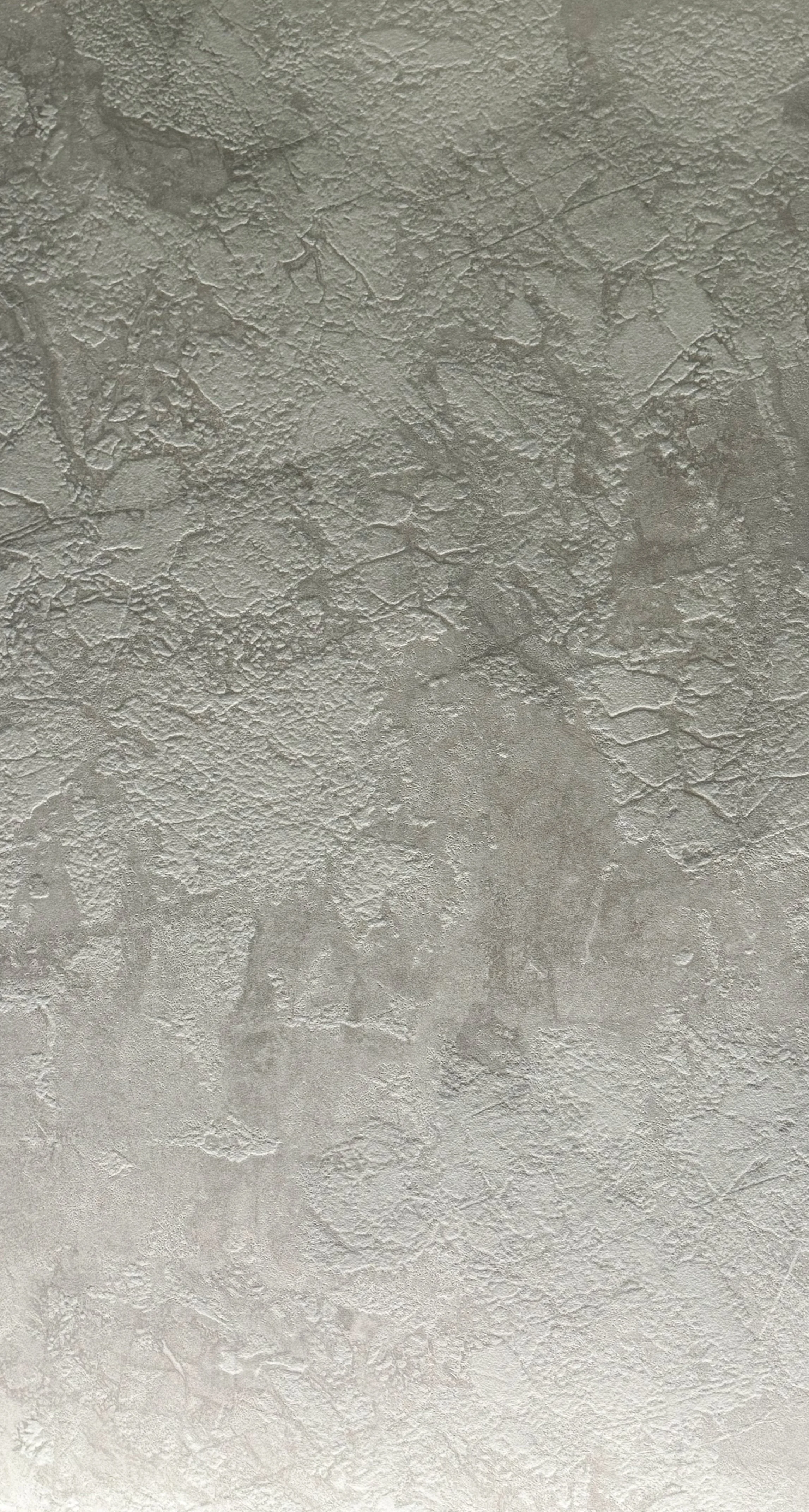 Glacier by plonc. — authored porcelain surface featuring layered geological relief inspired by aerial glacier formations, with pale mineral greys, restrained white tonal movement and subtle tactile texture.