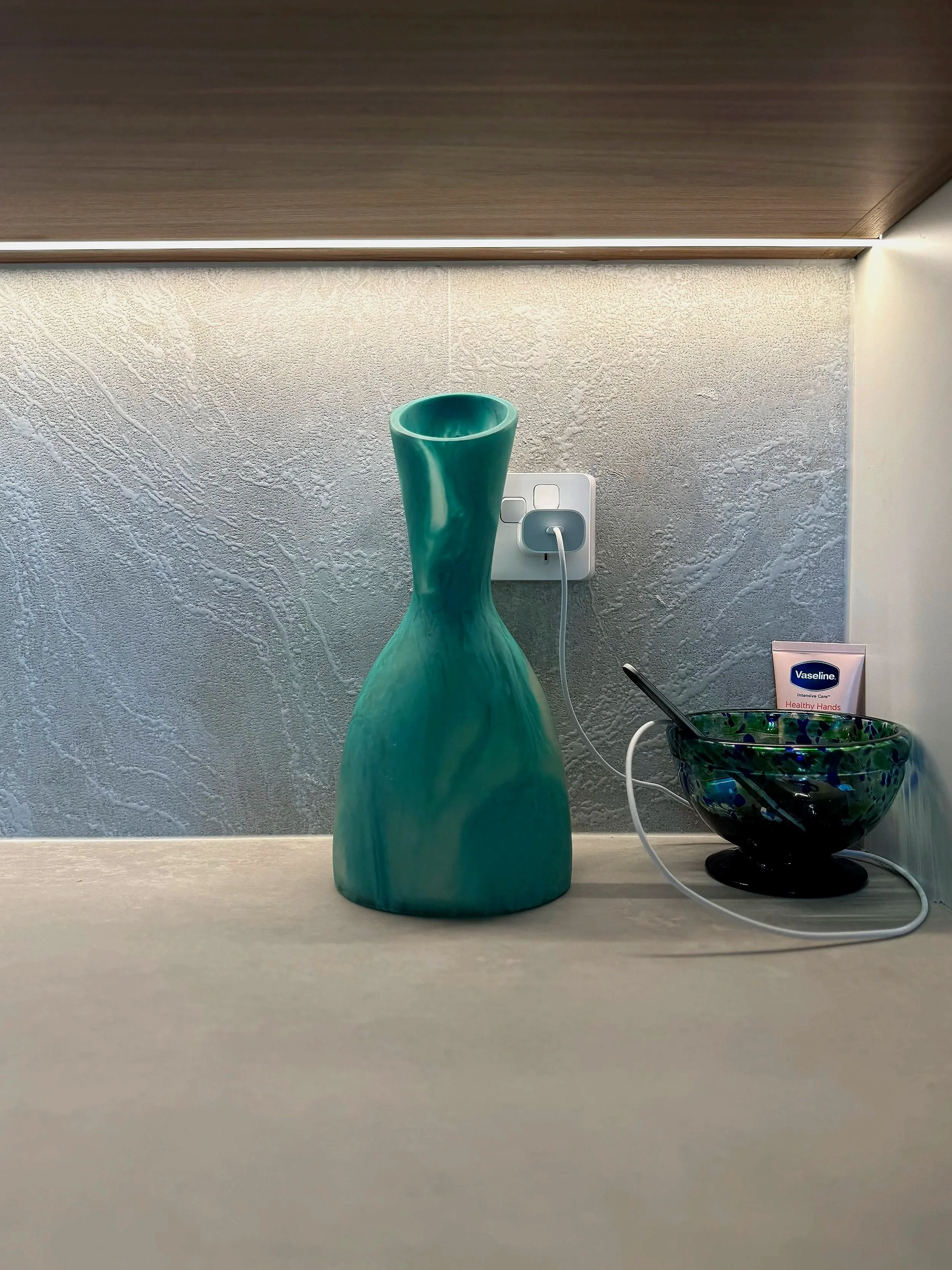 Glacier 3 textured porcelain tile by plonc., featuring an irregular white relief surface shaped by light and shadow.