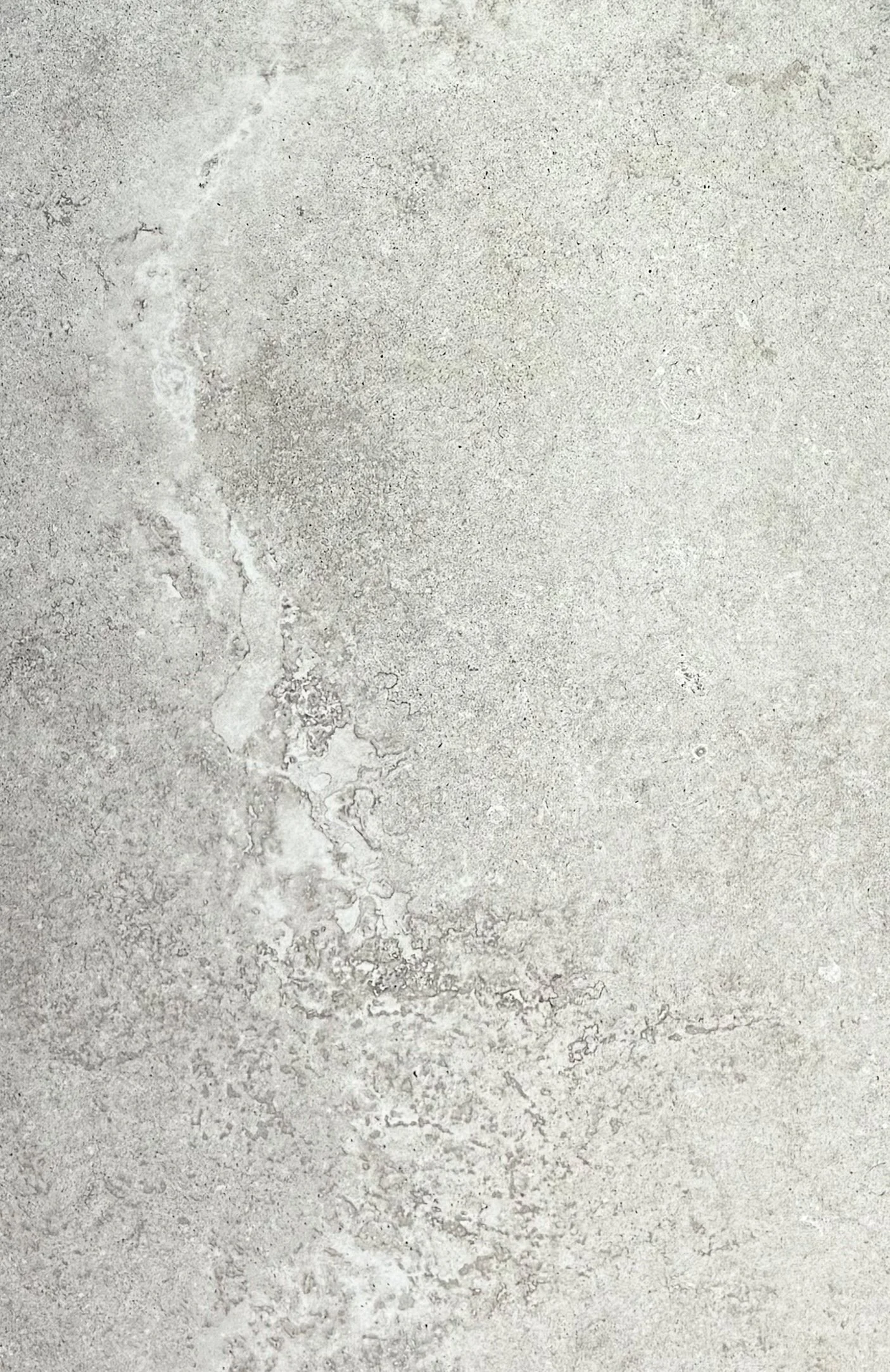 3rd Rock by plonc. — authored porcelain surface featuring sculpted mineral relief, layered geological movement and soft grey tonal variation inspired by Earth’s formation and planetary geology.