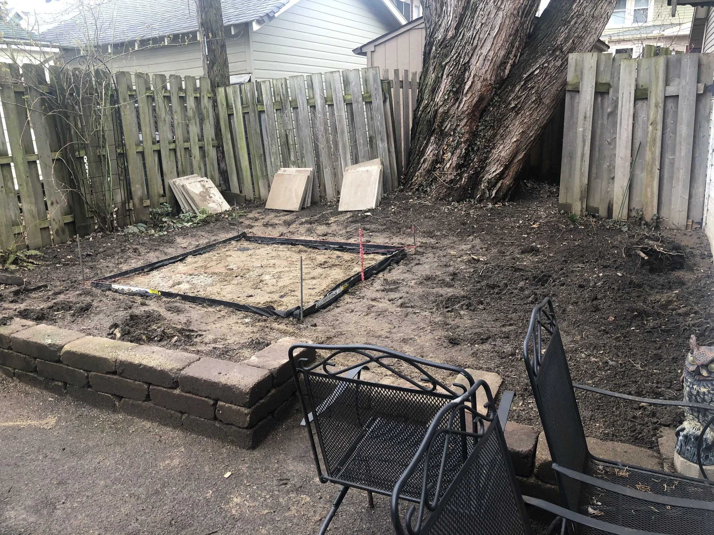  Ensuring proper drainage and avoiding settling was important.  We excavated and installed a deep layer of compacted aggregate and crushed limestone. 