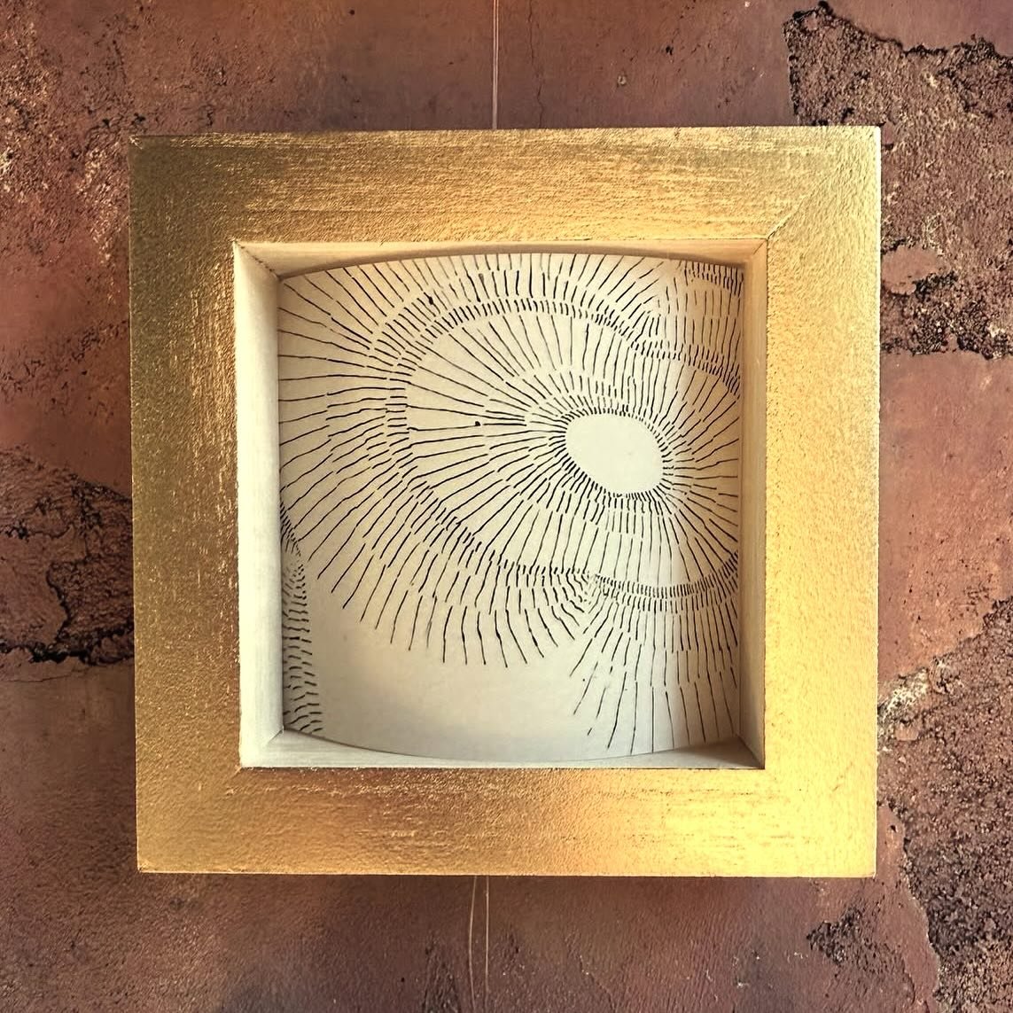 Tiny Topography &ndash; These small 5&rdquo; &times; 5&rdquo; gold boxes contain sketches of abstracted topography that invite close inspection, creating a counterpoint to the immersive  4&rsquo; &times; 6&rsquo; fabric panels on the opposite side of