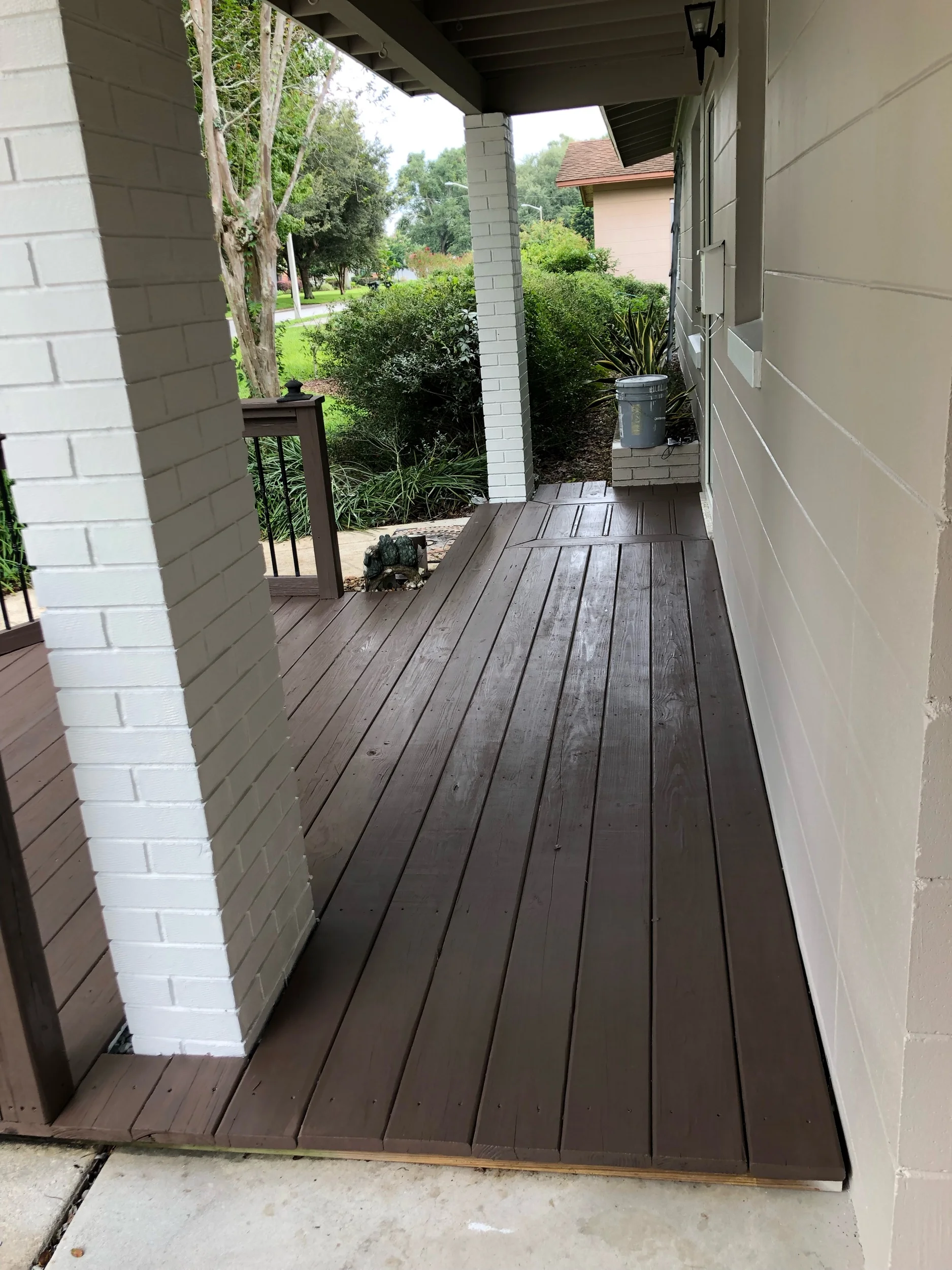 Solid stained wooden deck, one-coat coverage.