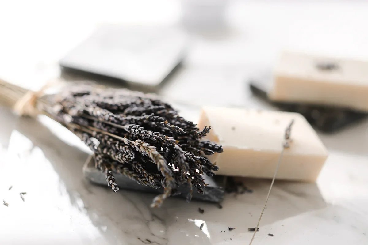 Soft towels and spa-inspired details creating a calm, private environment for a milk bath maternity photography session.