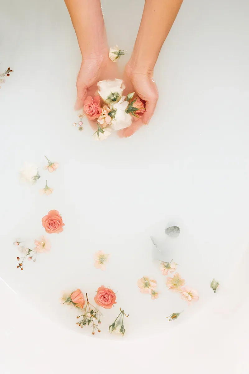 Warm water milk bath preparation with gentle, skin-safe elements for a relaxing maternity photography session in Indianapolis.