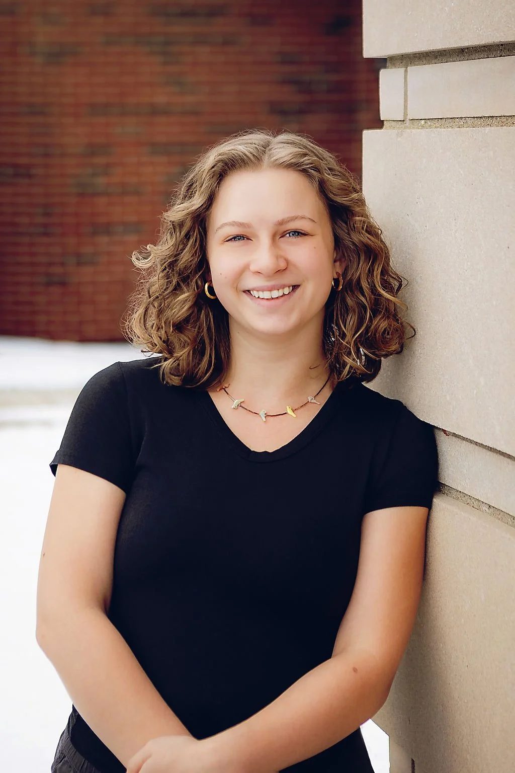 Headshot of prenatal massage therapist outside her Indianapolis office