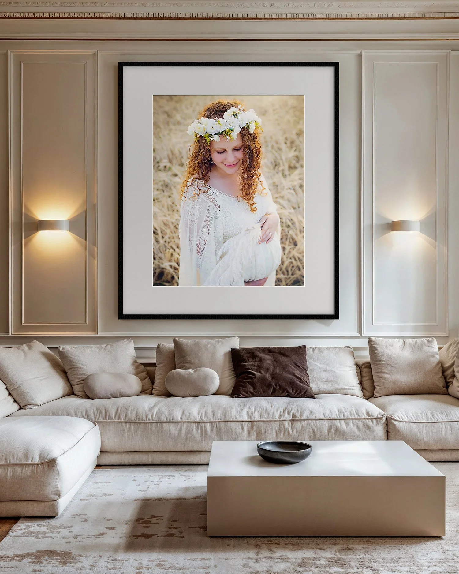Comfortable living room with large frames portrait of expecting mother in boho inspired floral crown and gown in Indianapolis field setting.