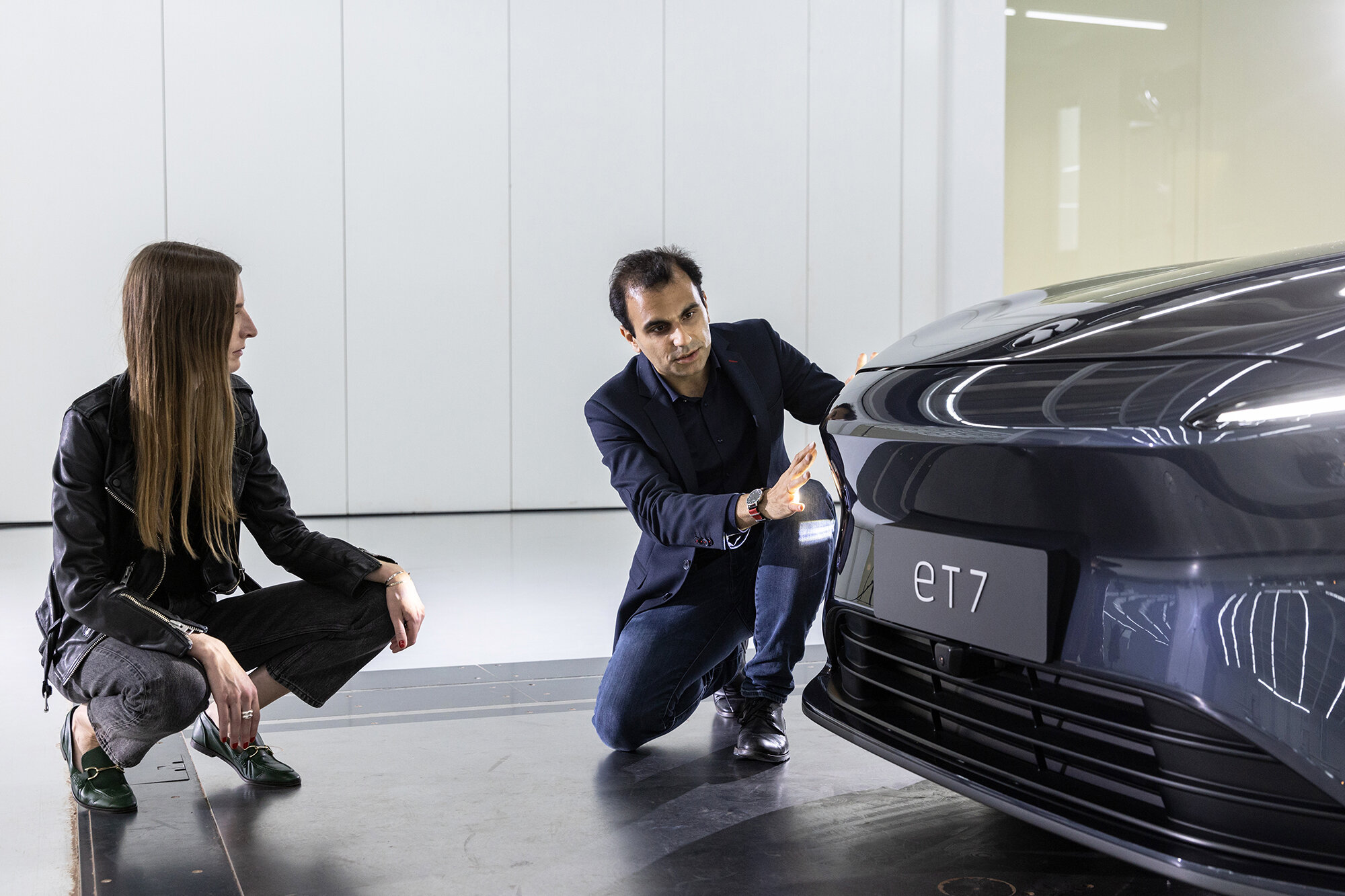 Founder of ellectric, Britta Reineke with NIO's Exterior Designer Ahmad Moslemifar talking about the front of the ET7