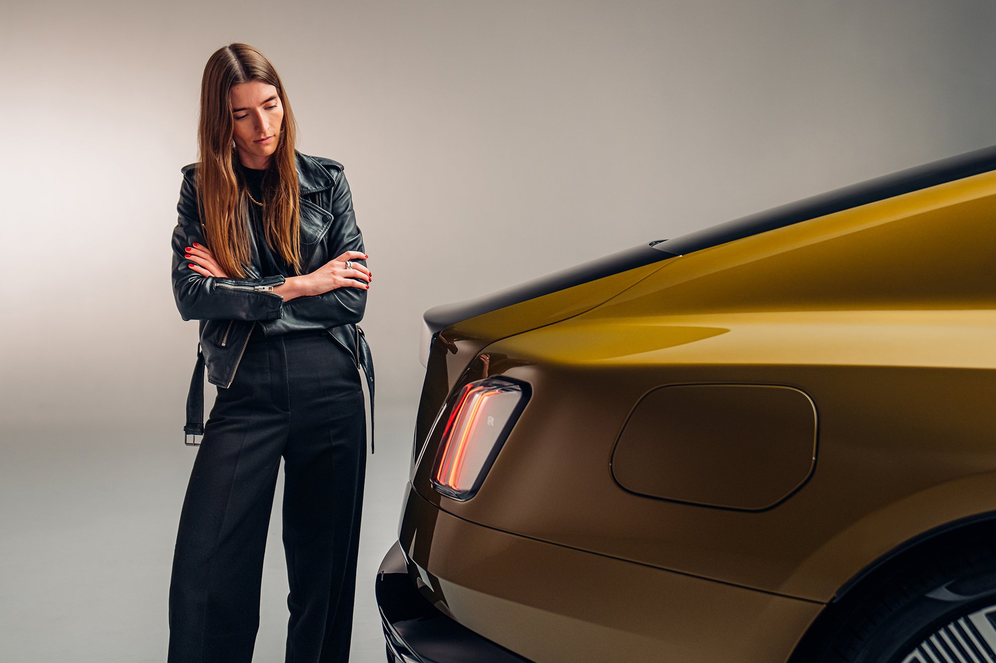 Britta Reineke, founder of ellectric looks at the backlight and rear design of the all-electric Rolls-Royce Spectre 