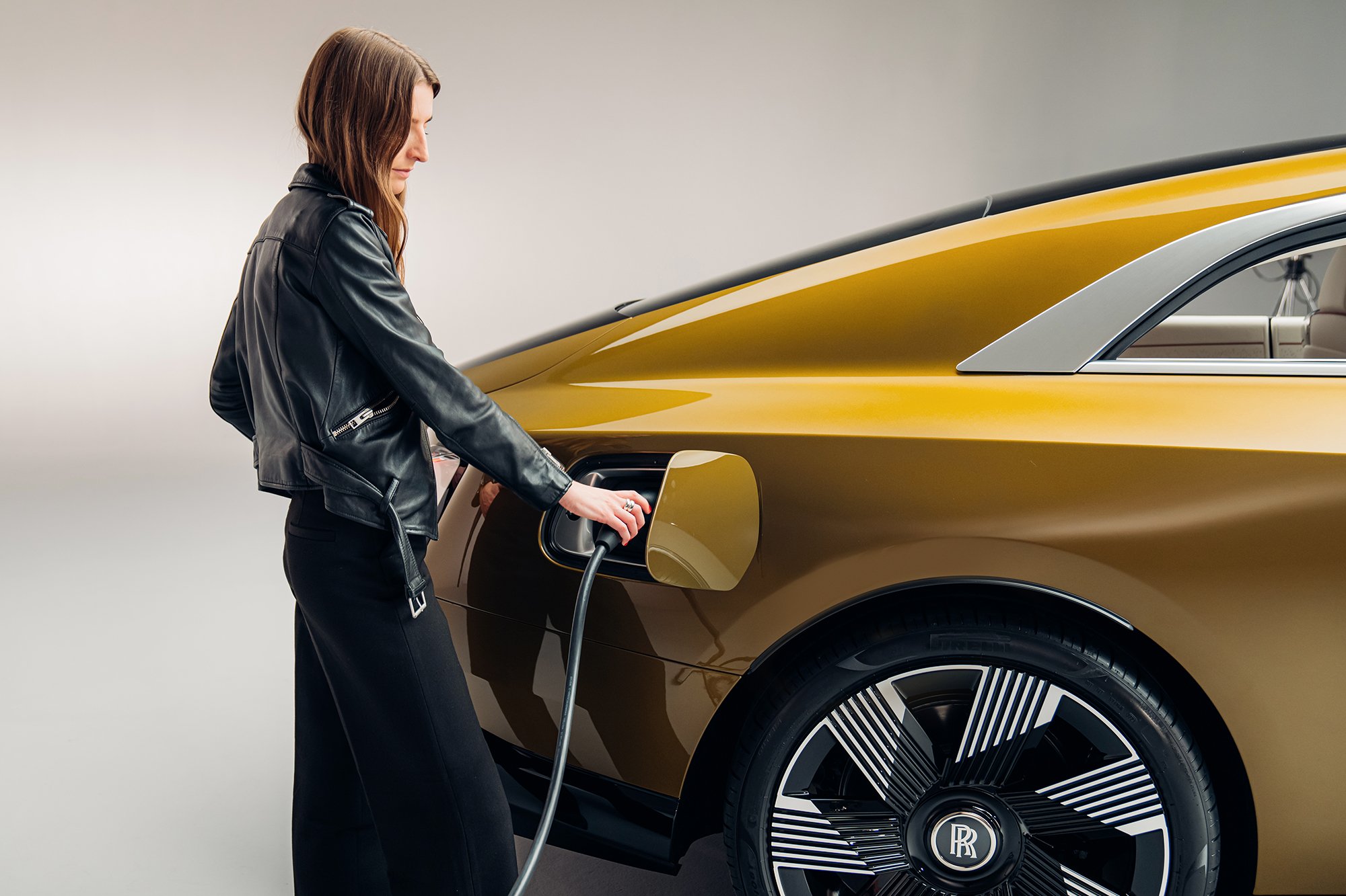 Britta Reineke, founder of ellectric charges the all-electric Rolls-Royce Spectre