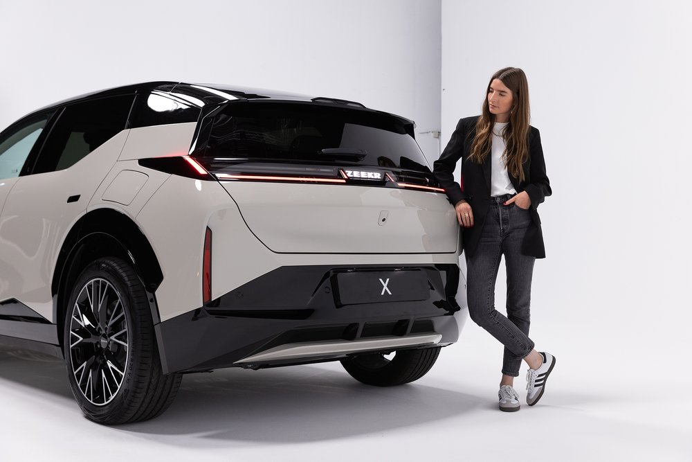 Britta Reineke, founder of ellectric showing the rear design of the all-electric ZEEKR X 