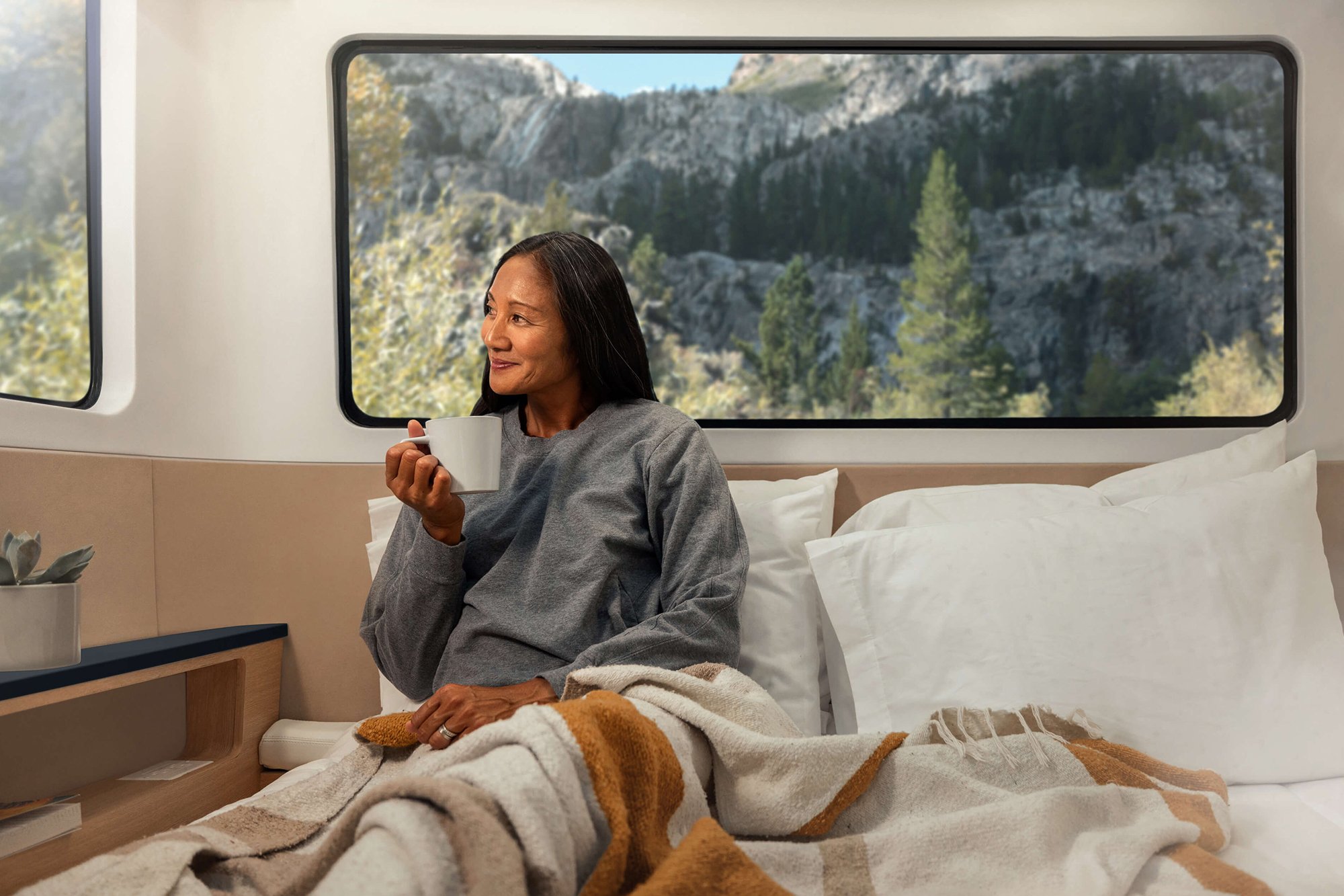 Interior and bed sign of the all-electric, self-propelled travel trailer Pebble Flow