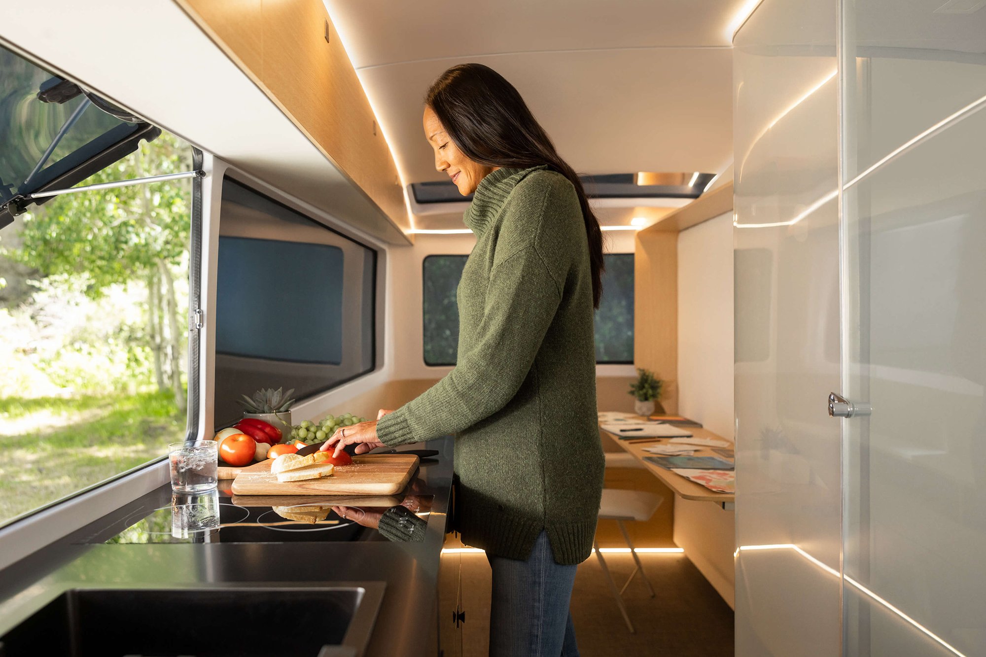 The kitchen design of the Interior of the all-electric, self-propelled travel trailer Pebble Flow