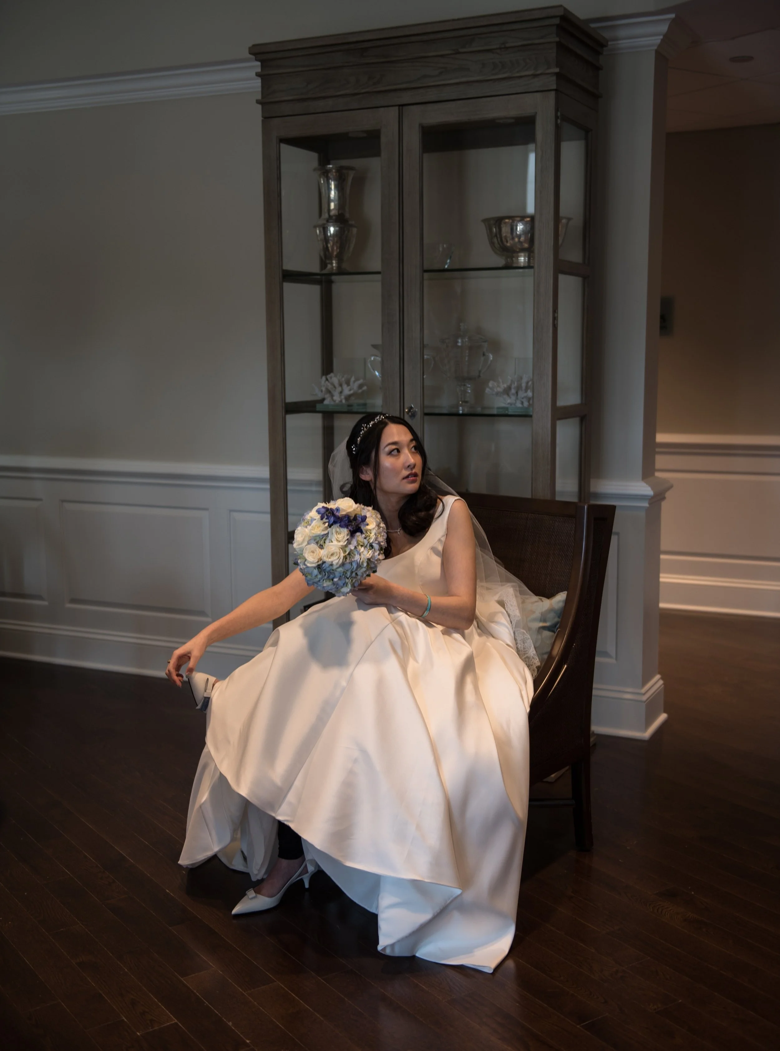 The story behind the first image where the bride is holding the tip of her Prada shoes.

While walking outside during the first look and then bride+groom photos she bumped into a tile and got some leather off the tip of her special shoe. It was bothe