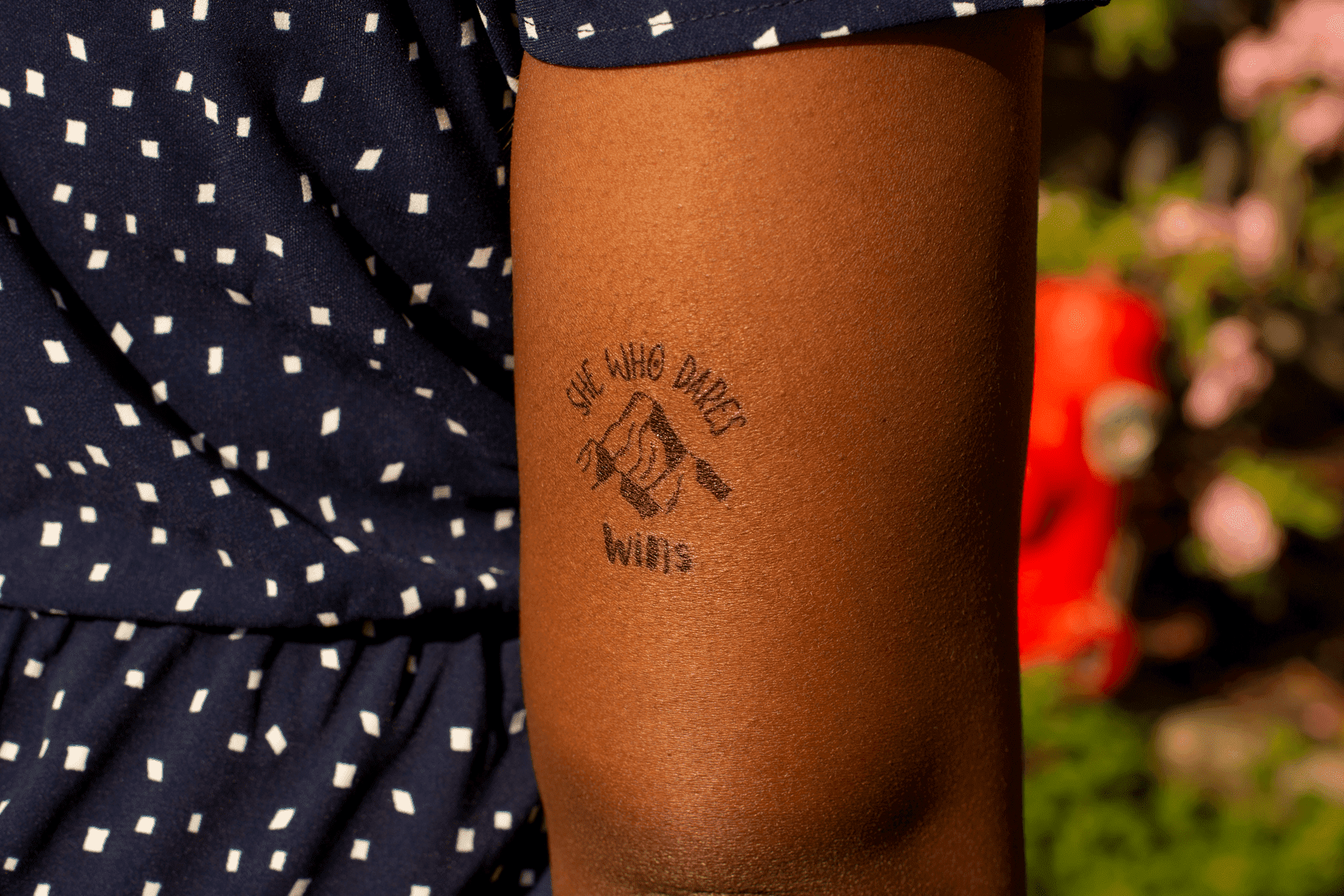 she-who-dares-wins-feminist-temporary-tattoo-on-dark-skin.png
