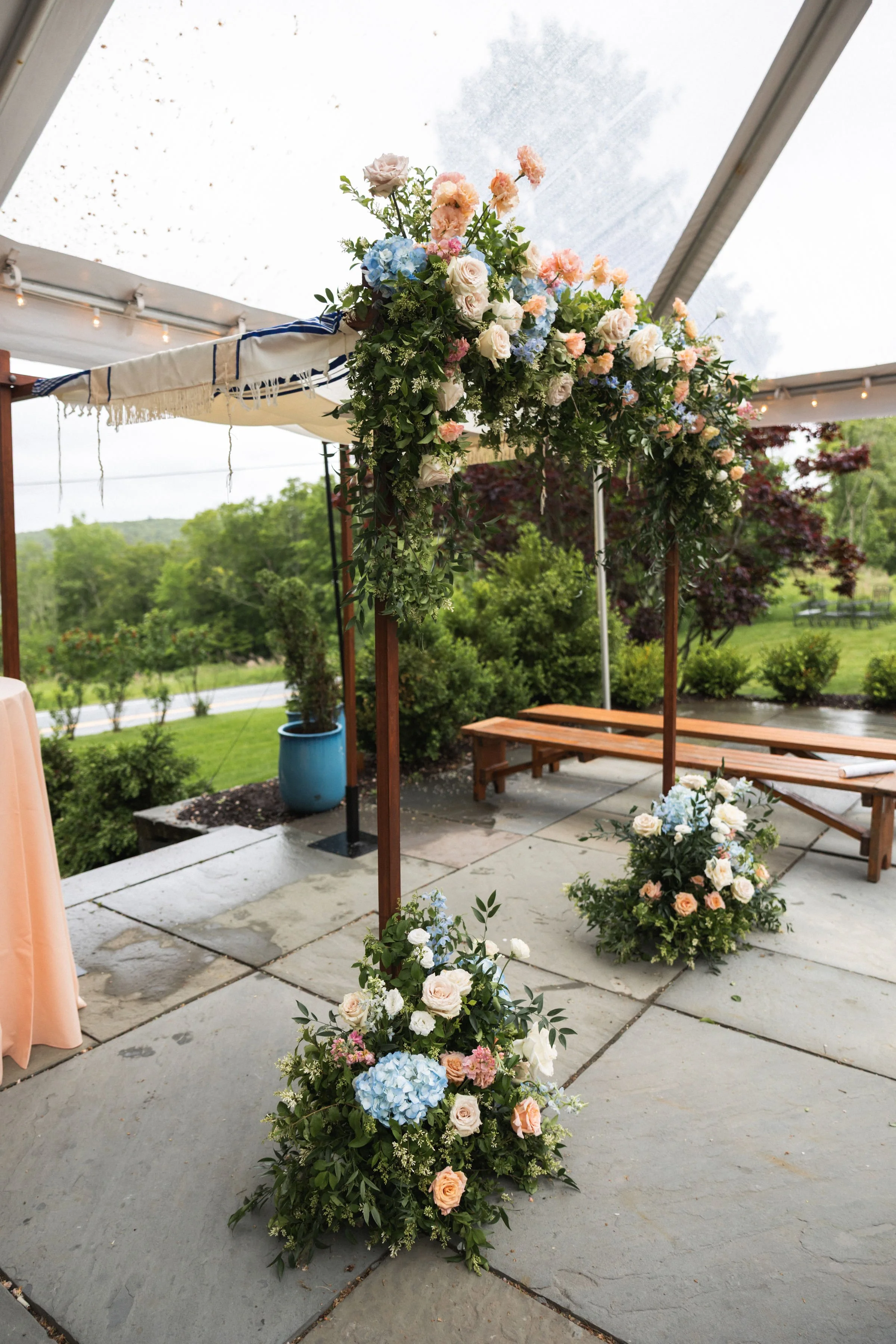 Chuppah Ceremony at Kenoza Hall Blue Stone Patio | Catskills Wedding Florals