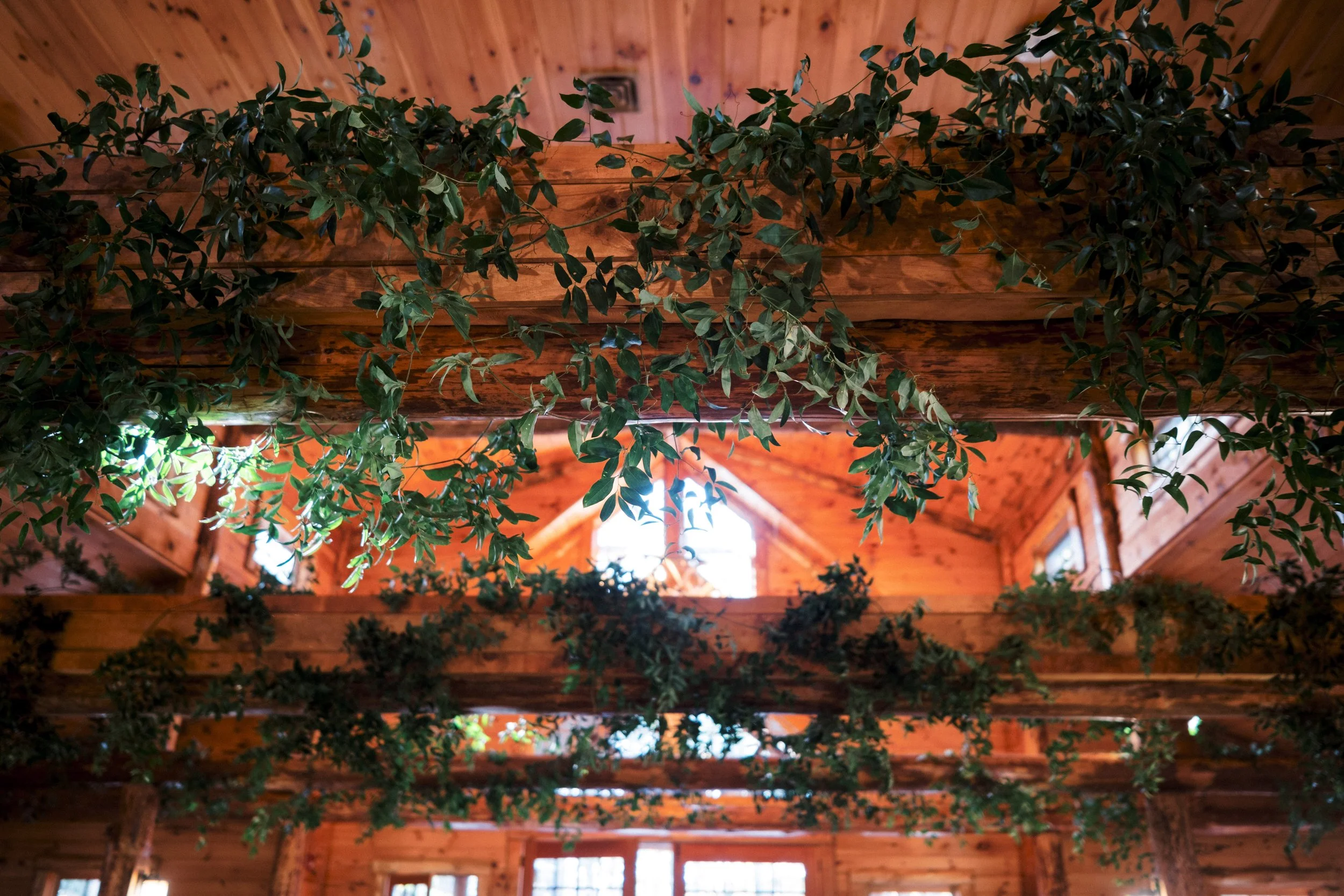 Styled Greenery in Reception Rafters | Chatwal Lodge Wedding