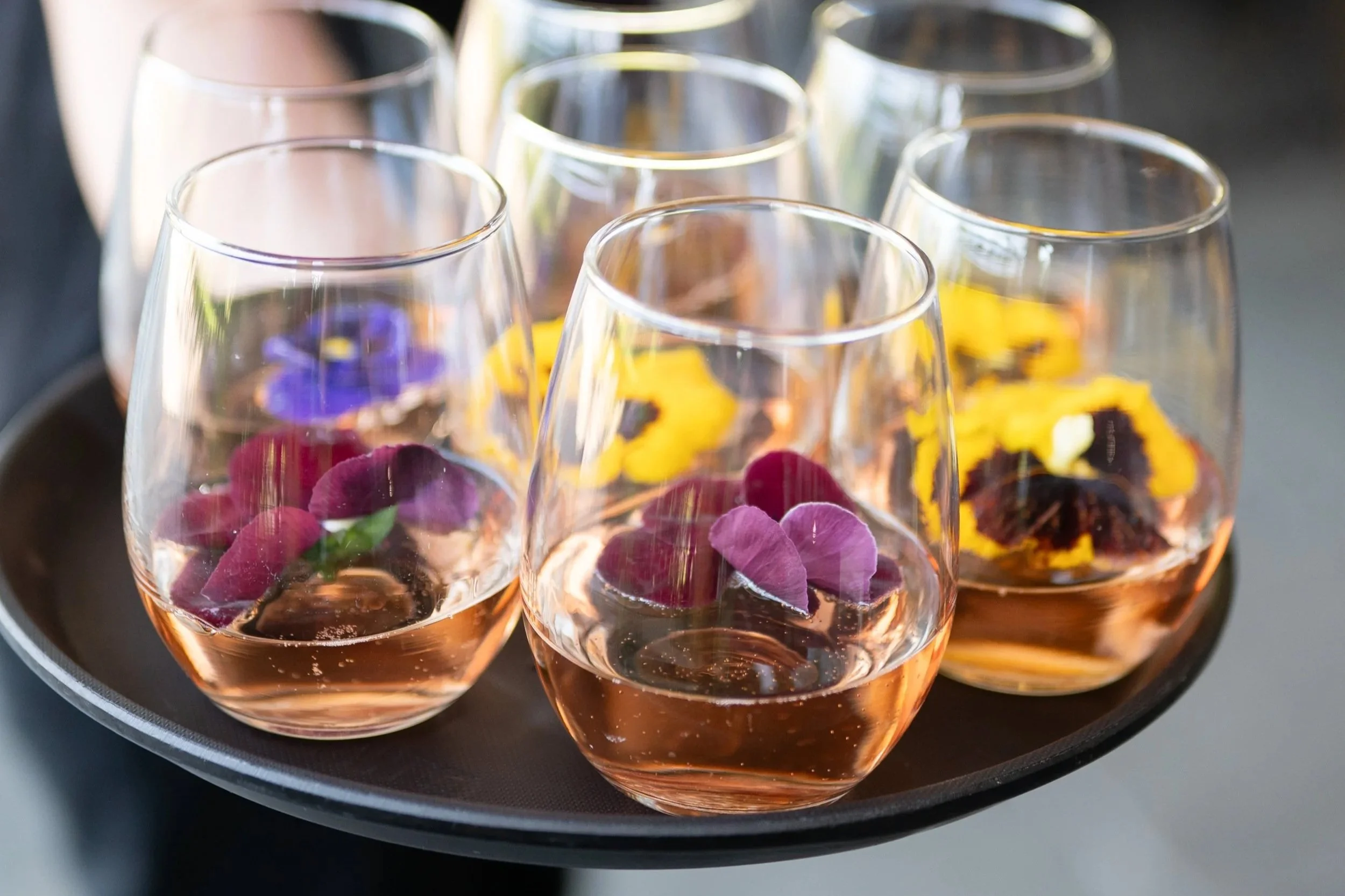 Summer blooms floating in wine glasses at Valley Rock Inn