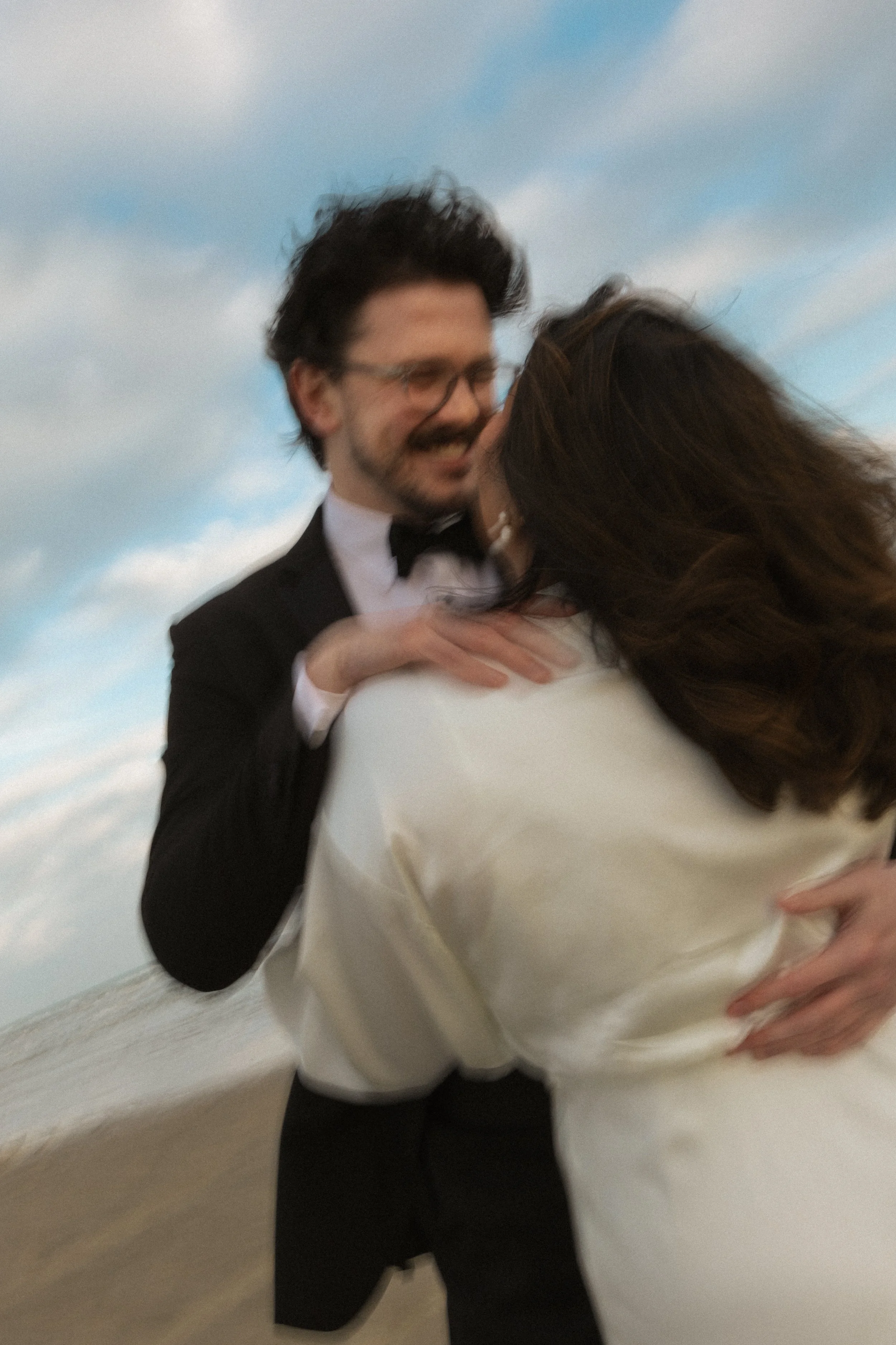 Blurry motion filled bridal photo of couple in Galveston