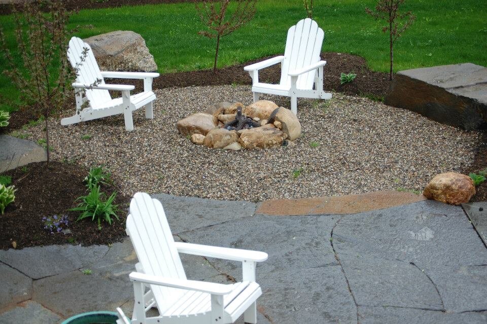 Pea stone patio and boulder fire pit.jpg
