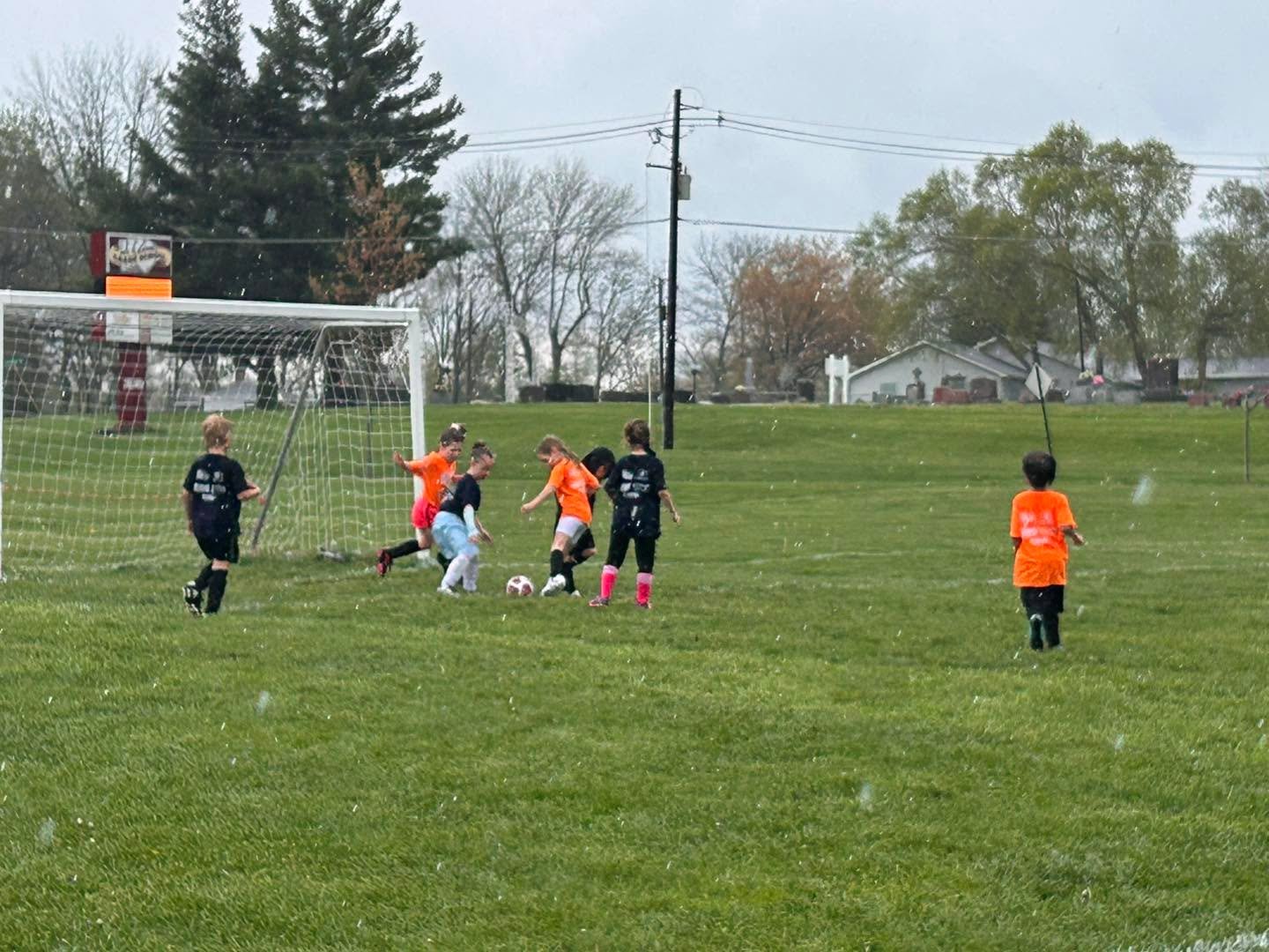 A little rainy for the last game of the day, but the kids are playing great!