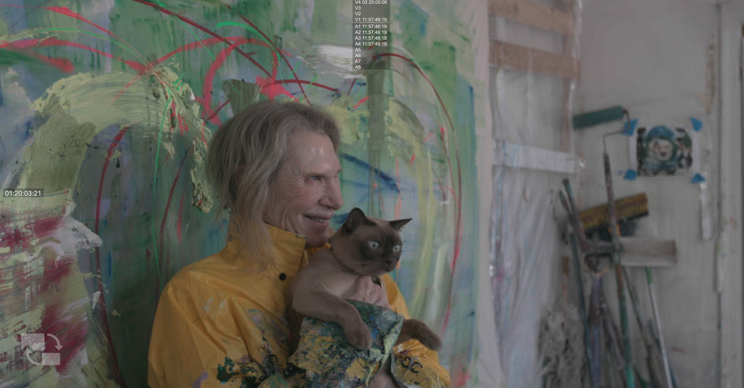 Francine Tint with cat against her canvas.png