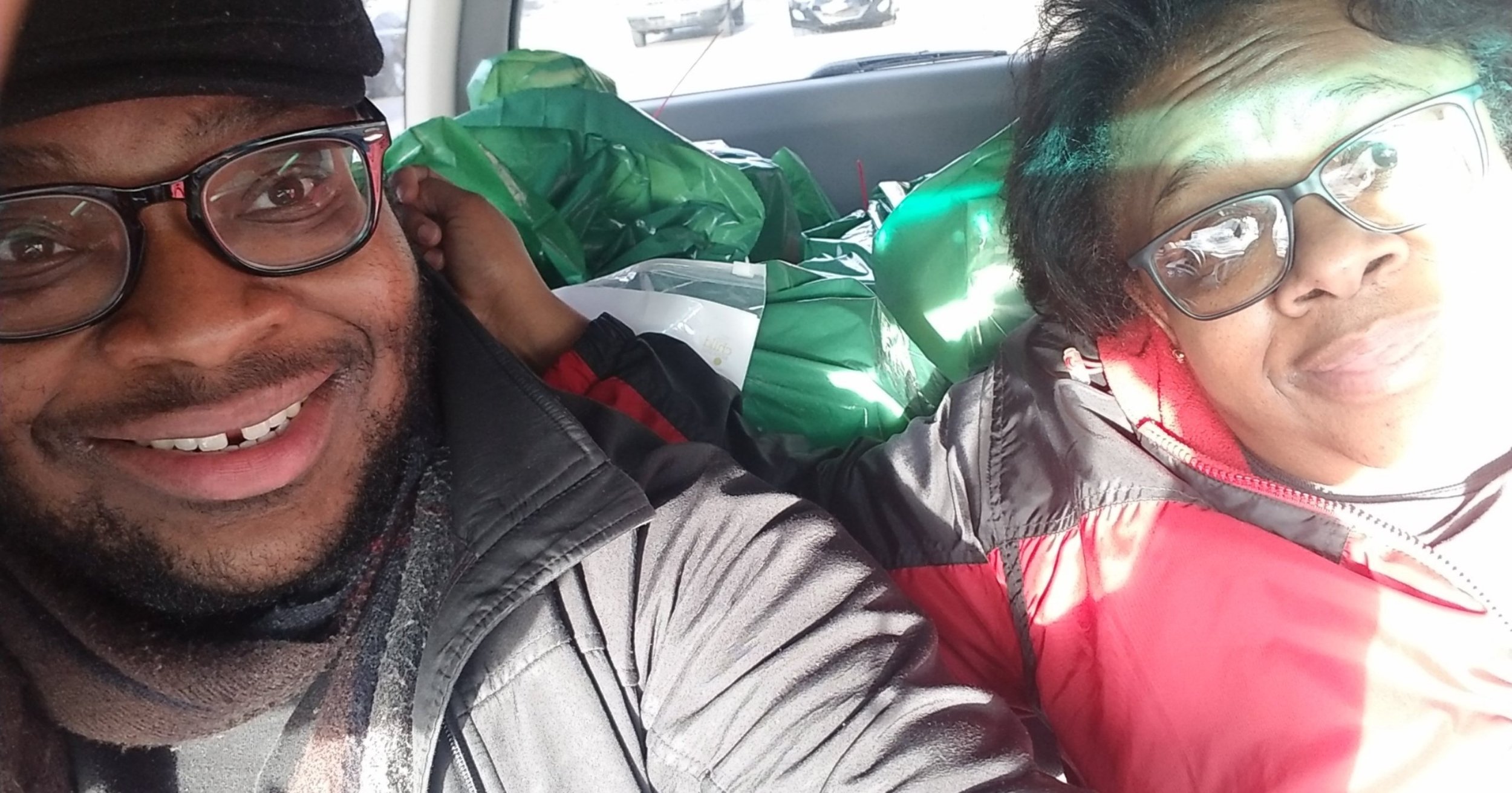  Our Executive Director and his mother in the car volunteering to deliver toys for the Support Center for Child Advocates Holiday Toy Drive in 2019. 