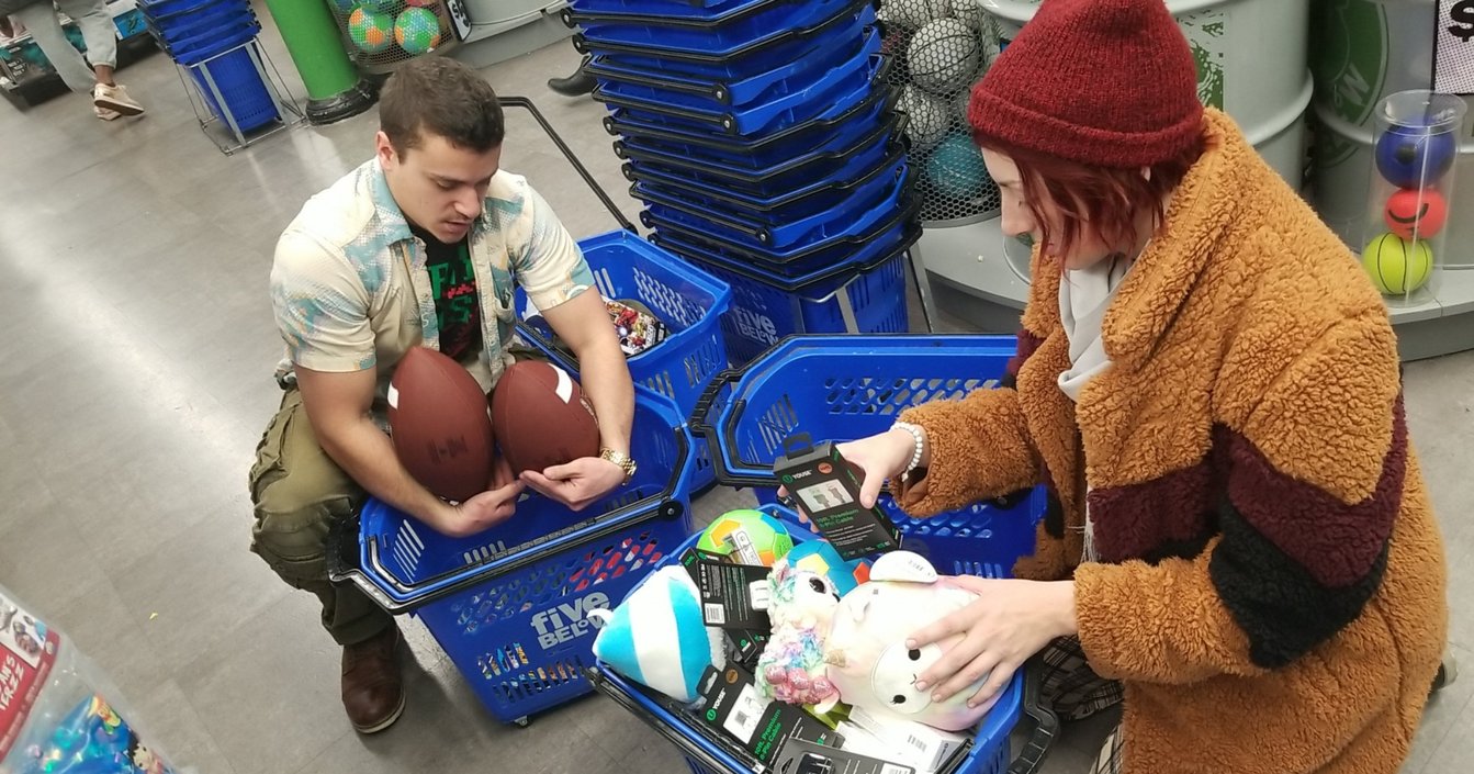  Two friends of Noteworthy helping organize toys for the Support Center for Child Advocates Holiday Toy Drive in December 2019. 