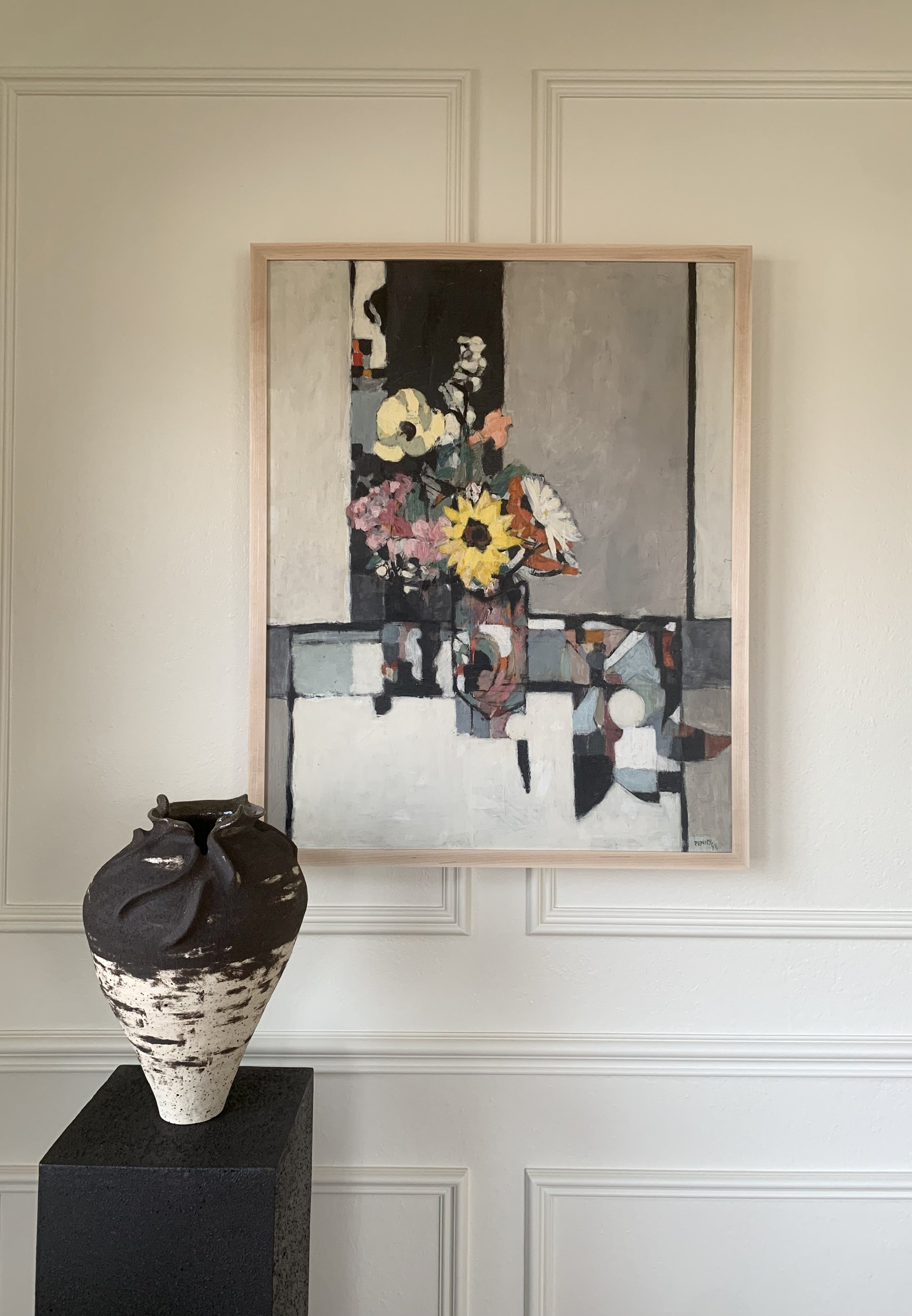 Detail of ‘Cubist Floral Still Life’ (ca. 1960s), a framed oil painting depicting a lively floral bouquet shown hung on a wall in a room.