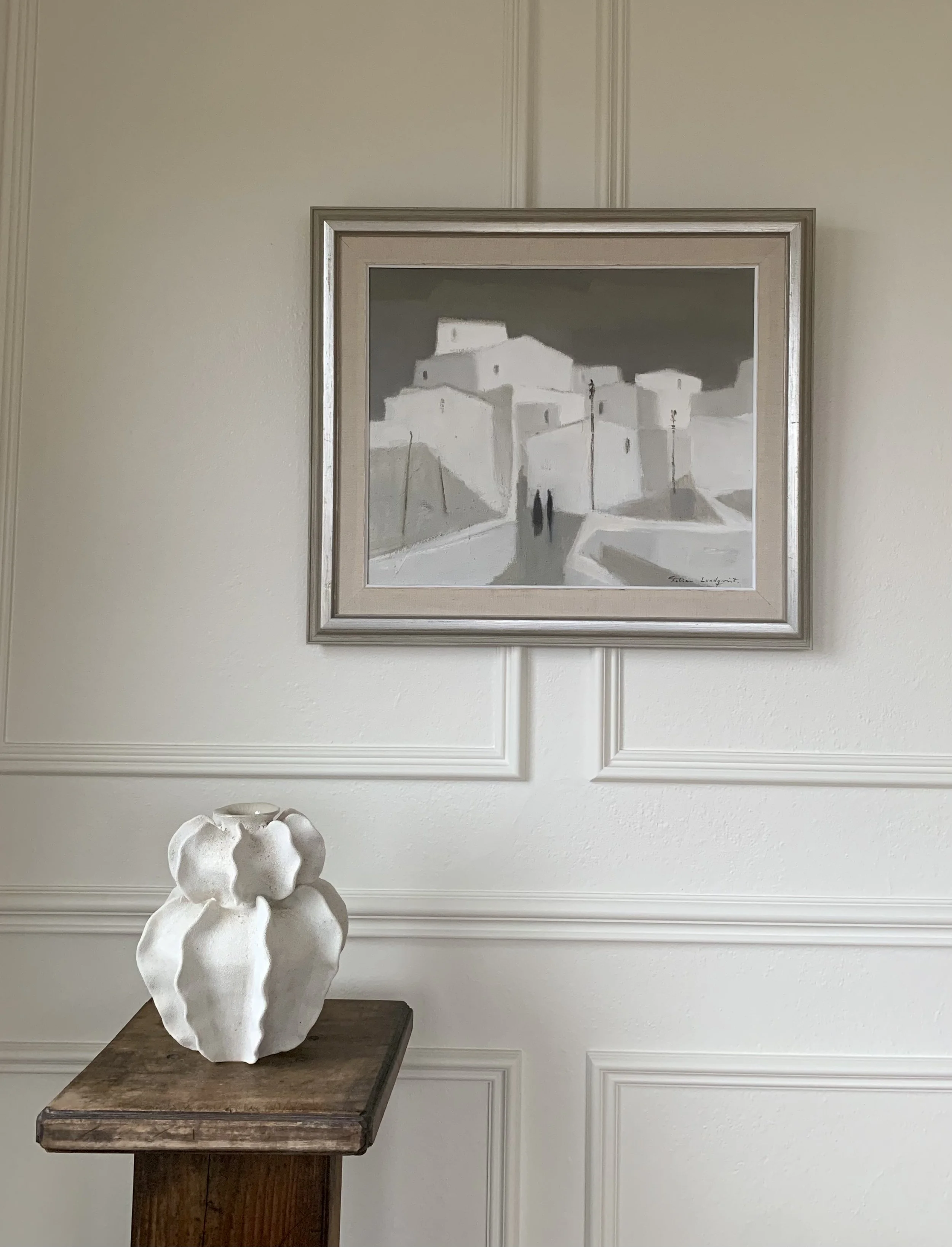 Detail of ‘Spanish Village’ (ca. 1960s) by Fabian Lundqvist, hanging on a wall next to a handbuilt ceramic vase