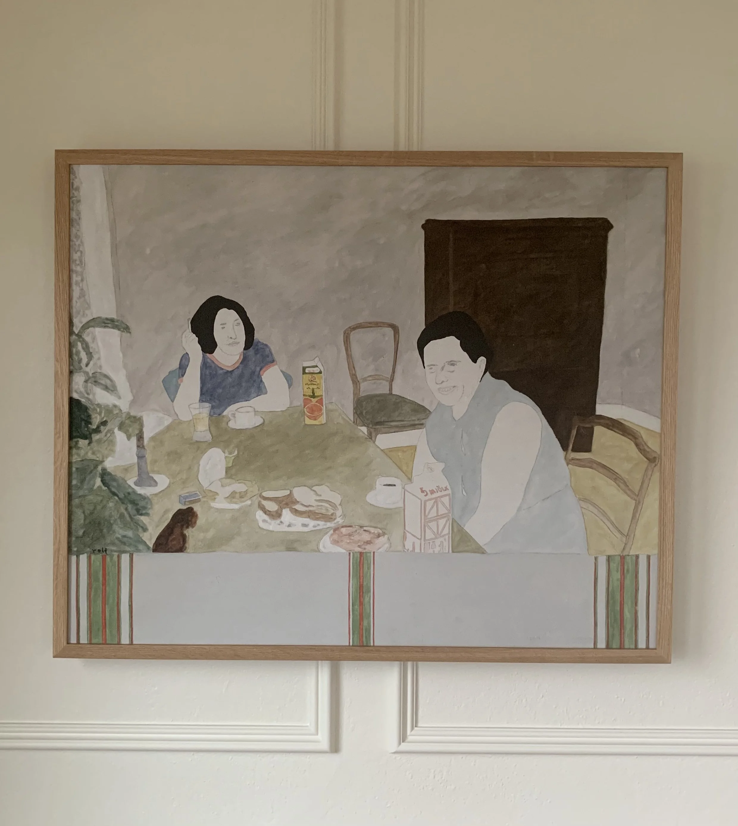 ‘Breakfast’ (ca. 1970s), a framed oil painting by Rolf Pettersson depicting an interior scene of two people sitting at a table eating breakfast.