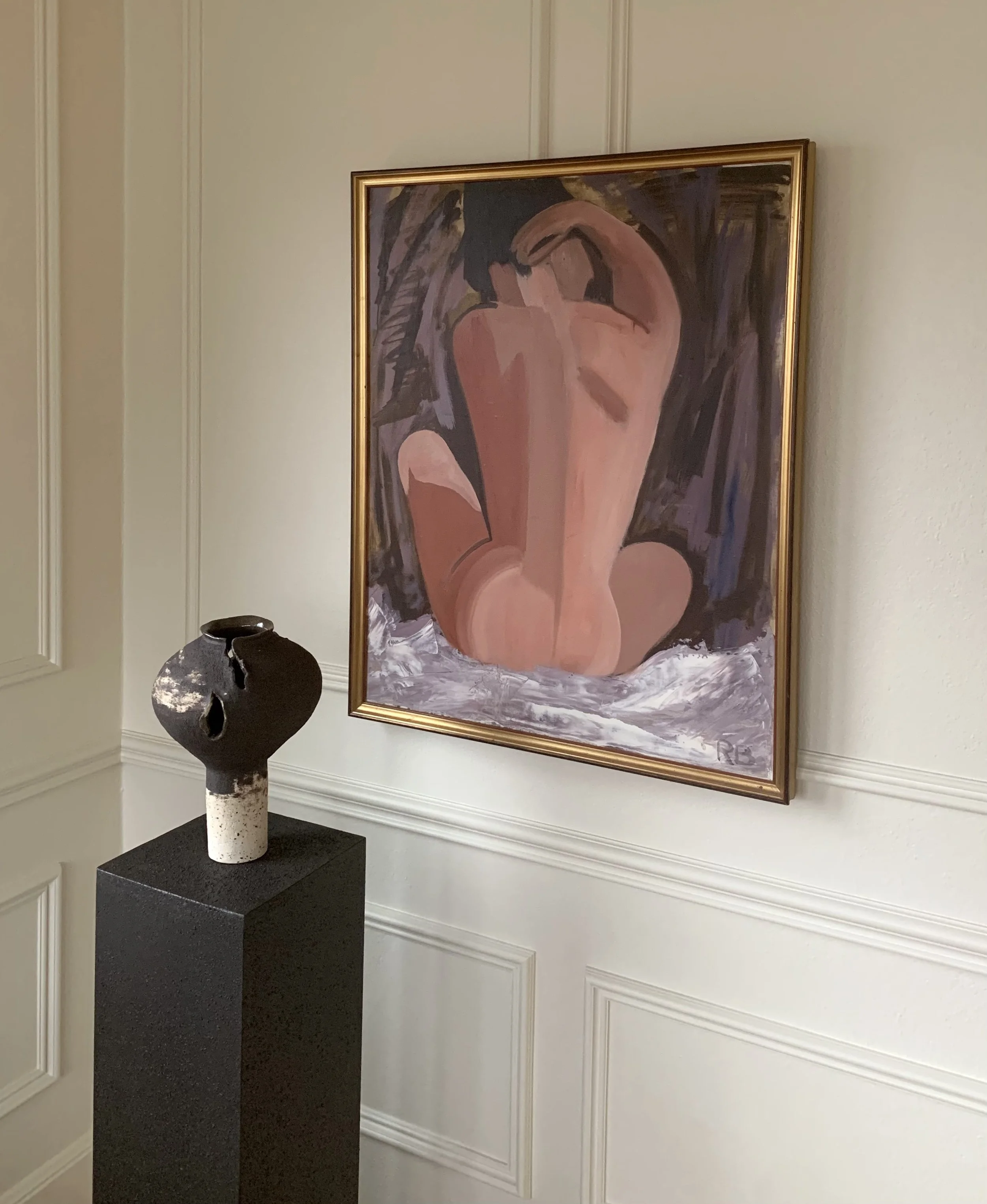 Detail of ‘Model Study’ (ca. 1960s), a framed oil painting showing the painting hanging on a wall in a room.