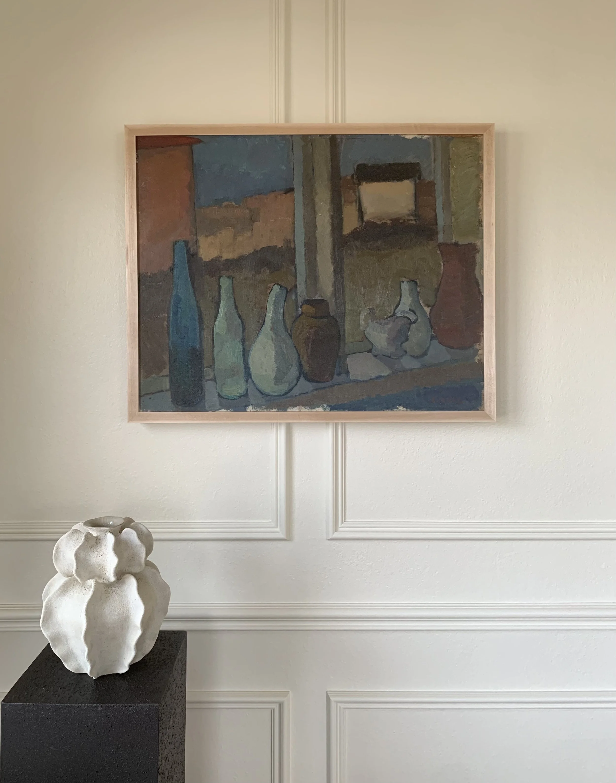 Detail of ‘Pottery Studio Still Life’ (ca. 1950s) by Bengt Crantz, showing the painting hanging on a wall in a room.